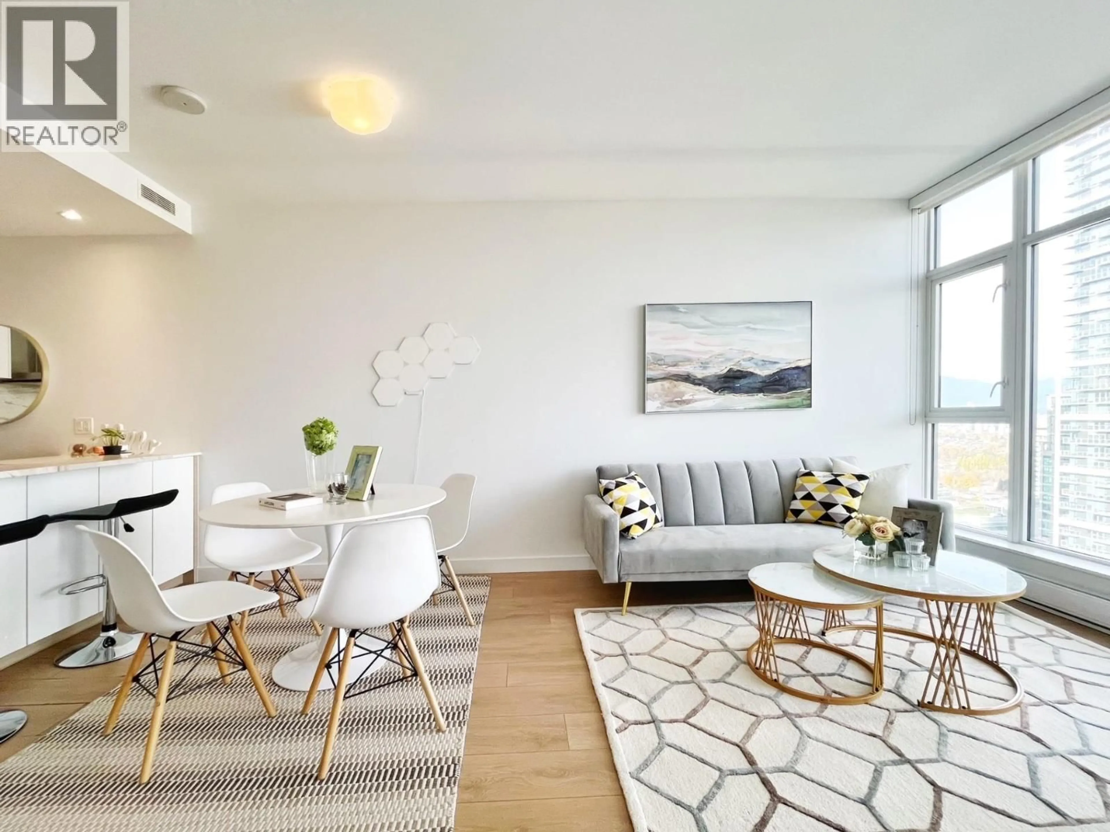 Living room with furniture, wood/laminate floor for 2308 - 6098 STATION STREET, Burnaby British Columbia V5H0H4