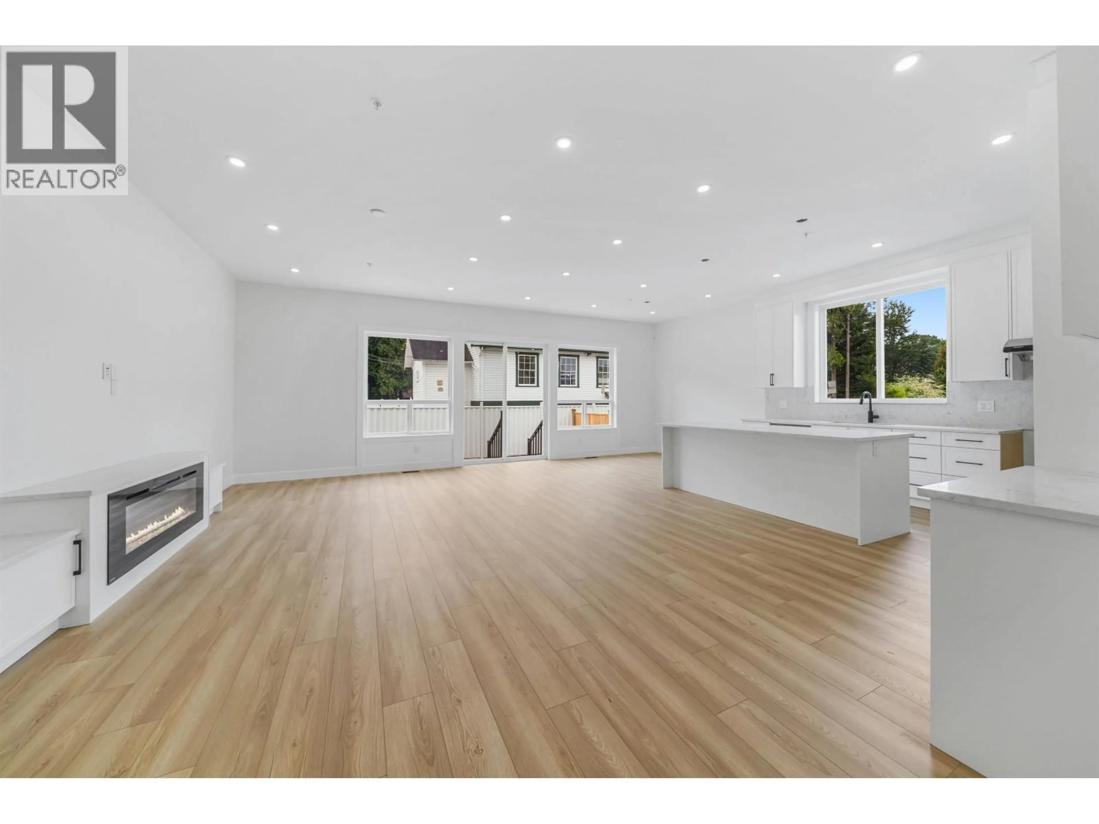 Open concept kitchen, wood/laminate floor for 19098 DOERKSEN DRIVE, Pitt Meadows British Columbia V3Y2C4