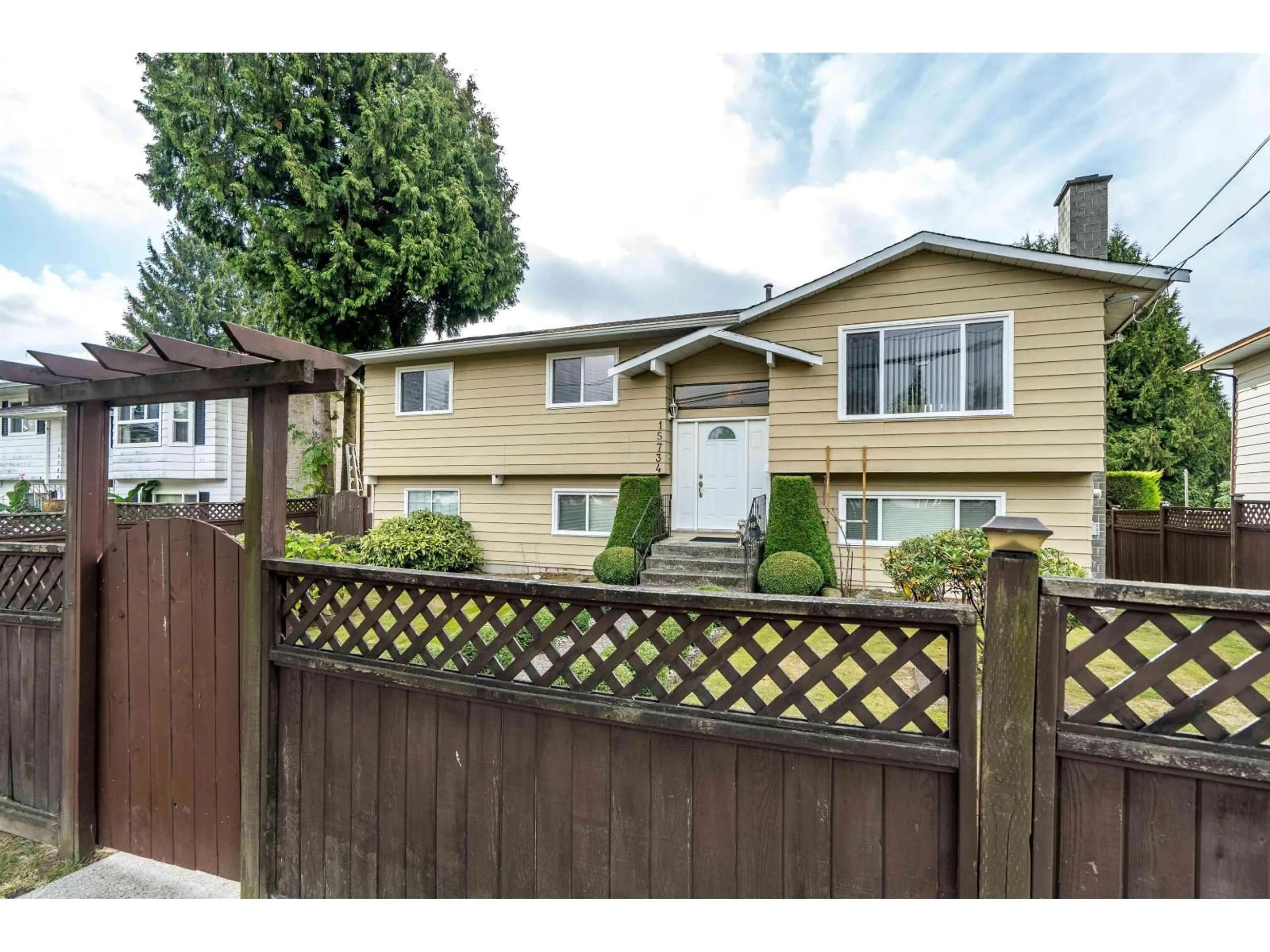 Home with vinyl exterior material, street for 15734 96 AVENUE, Surrey British Columbia V4N2L2