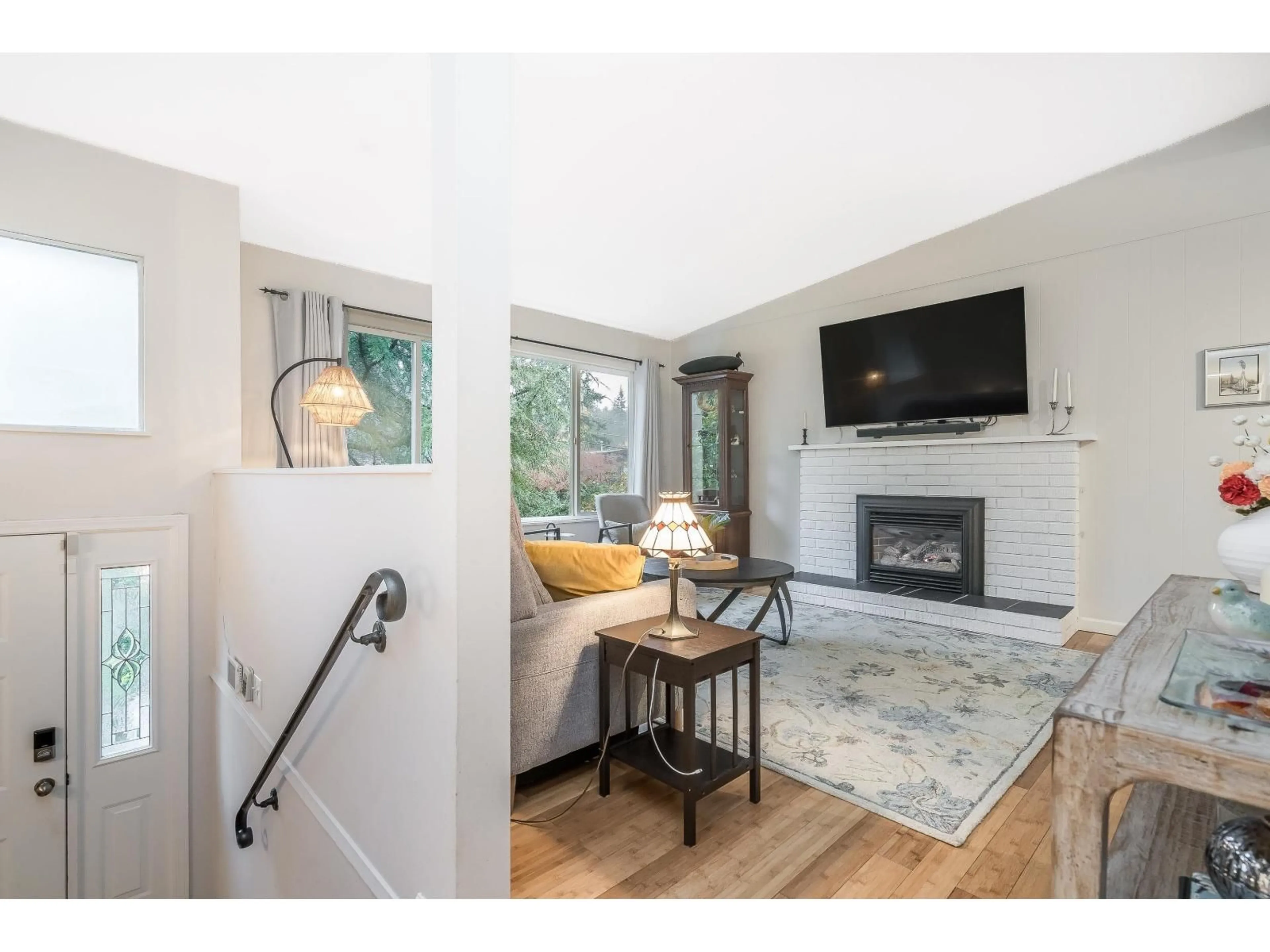 Living room with furniture, wood/laminate floor for 20738 38A, Langley British Columbia V3A2V4