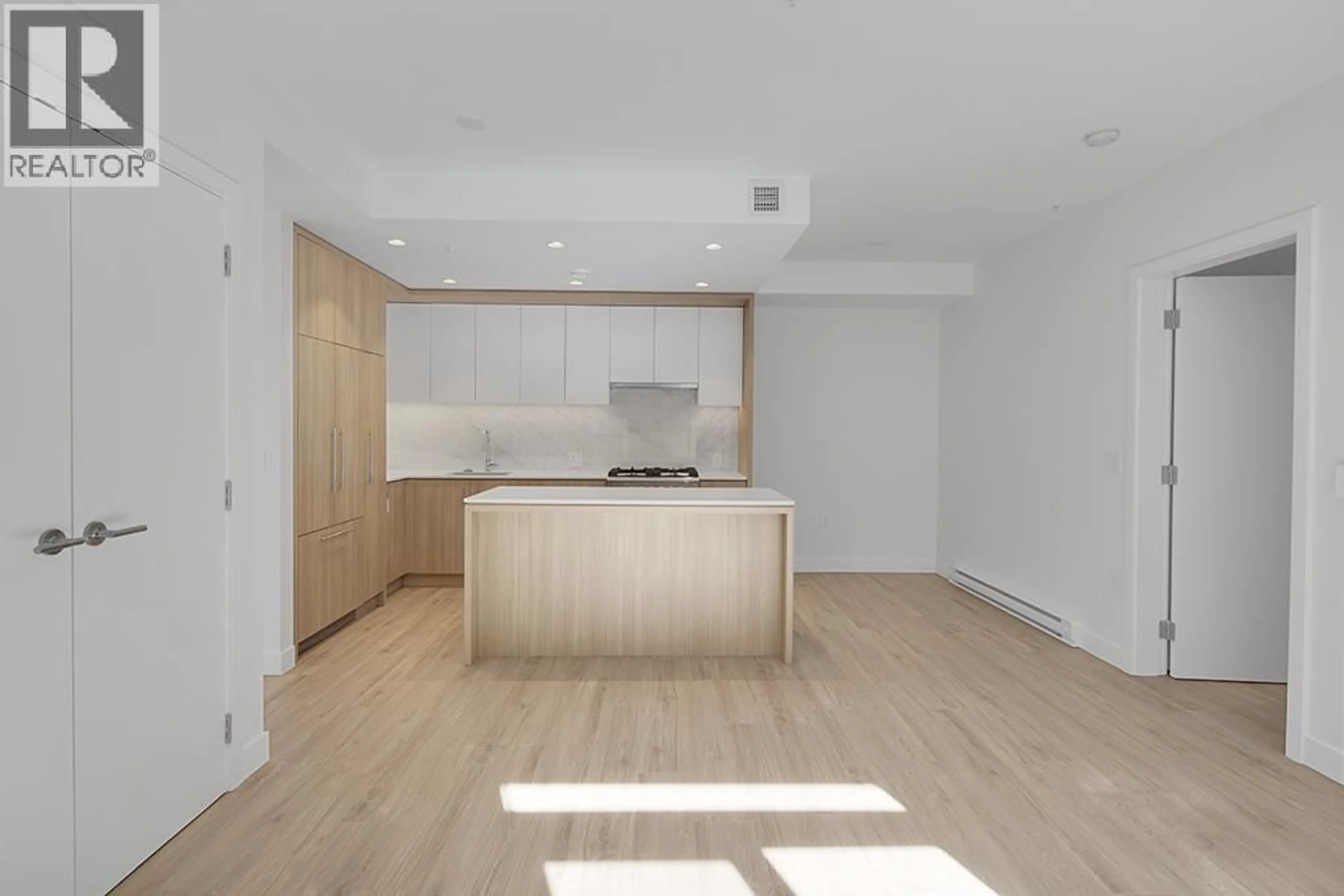 Open concept kitchen, wood/laminate floor for 208 - 6085 IRMIN STREET, Burnaby British Columbia V5J5C5