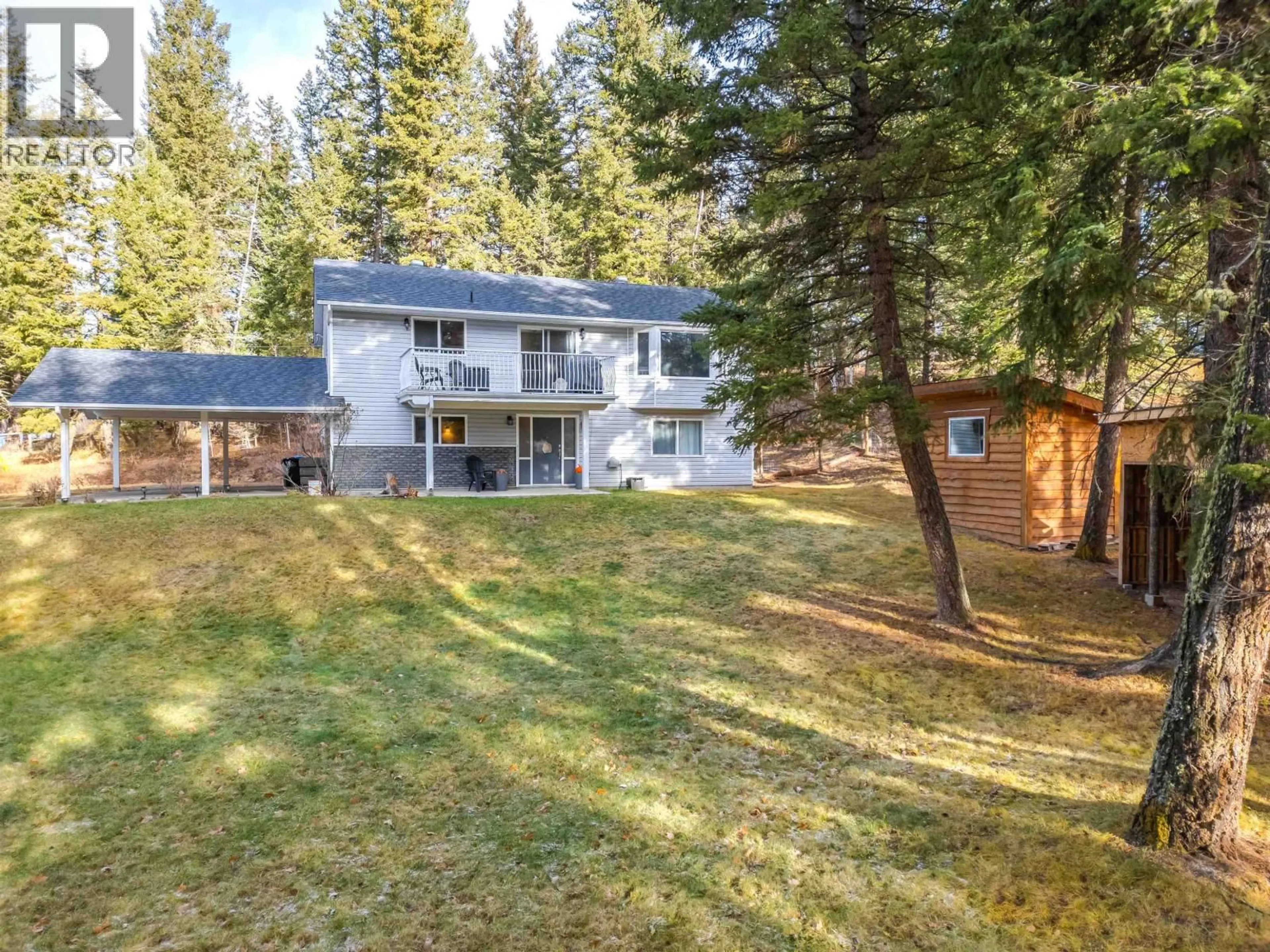 A pic from outside/outdoor area/front of a property/back of a property/a pic from drone, forest/trees view for 5423 KITSUM COURT, 108 Mile Ranch British Columbia V0K2Z0