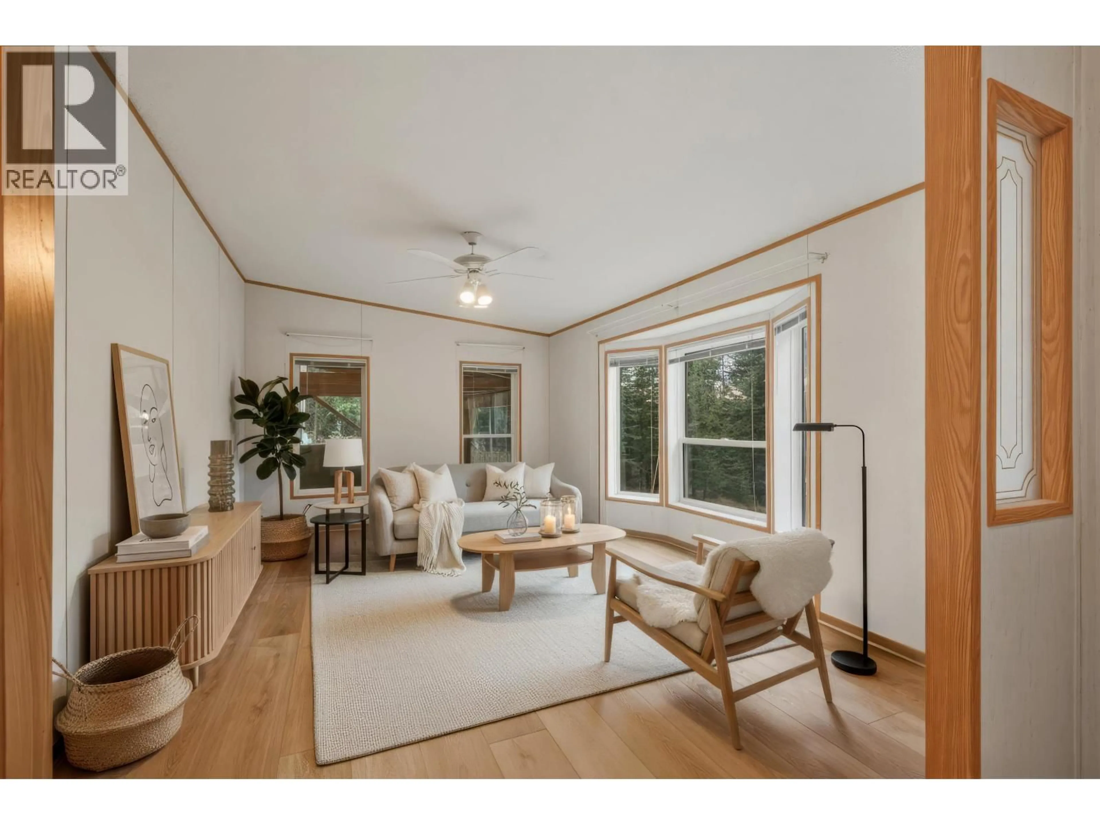 Living room with furniture, wood/laminate floor for 2862 PIONEER CRESCENT, 150 Mile House British Columbia V0K2G0