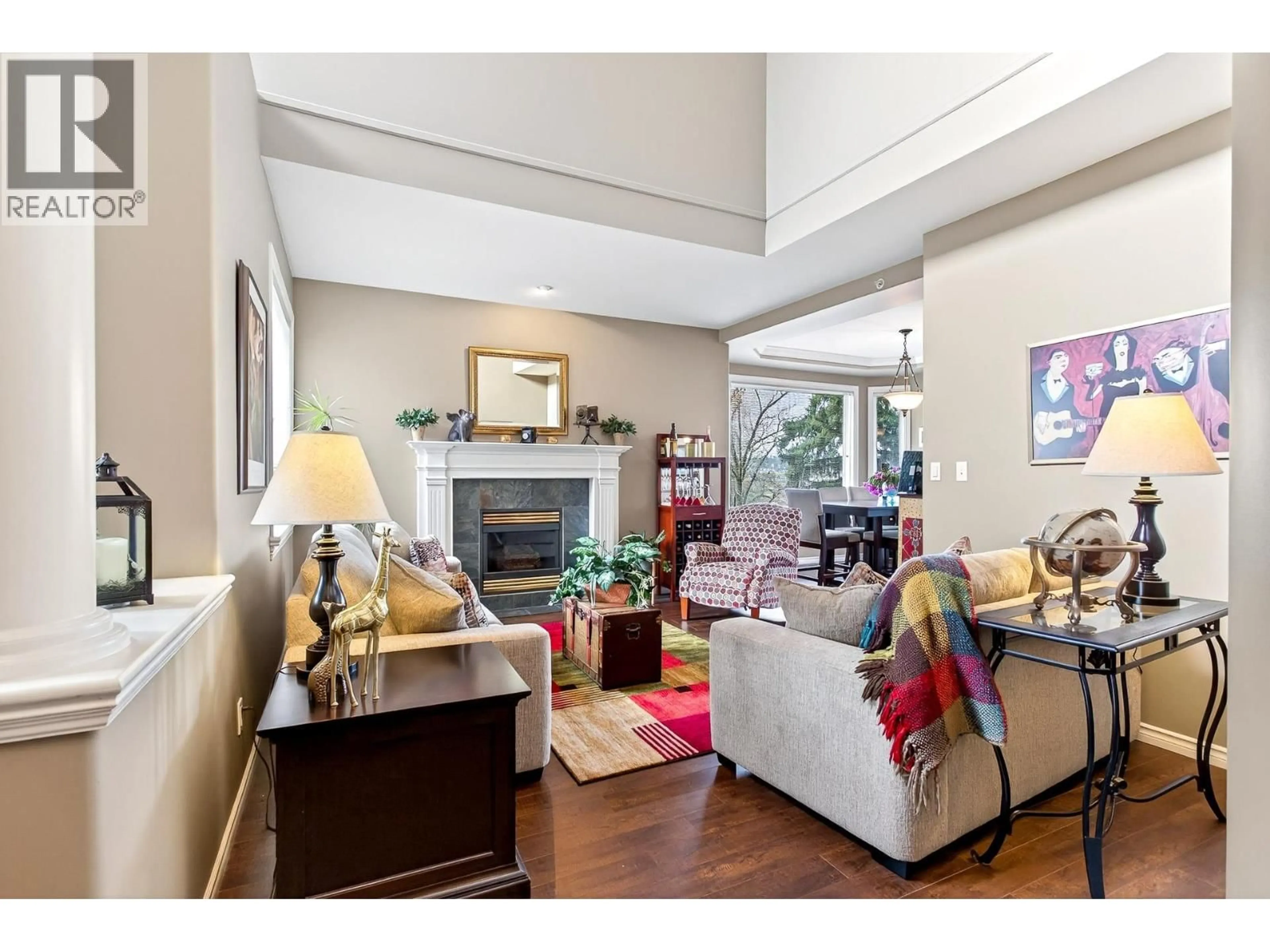 Living room with furniture, wood/laminate floor for 112 - 678 CITADEL DRIVE, Port Coquitlam British Columbia V3C6M7