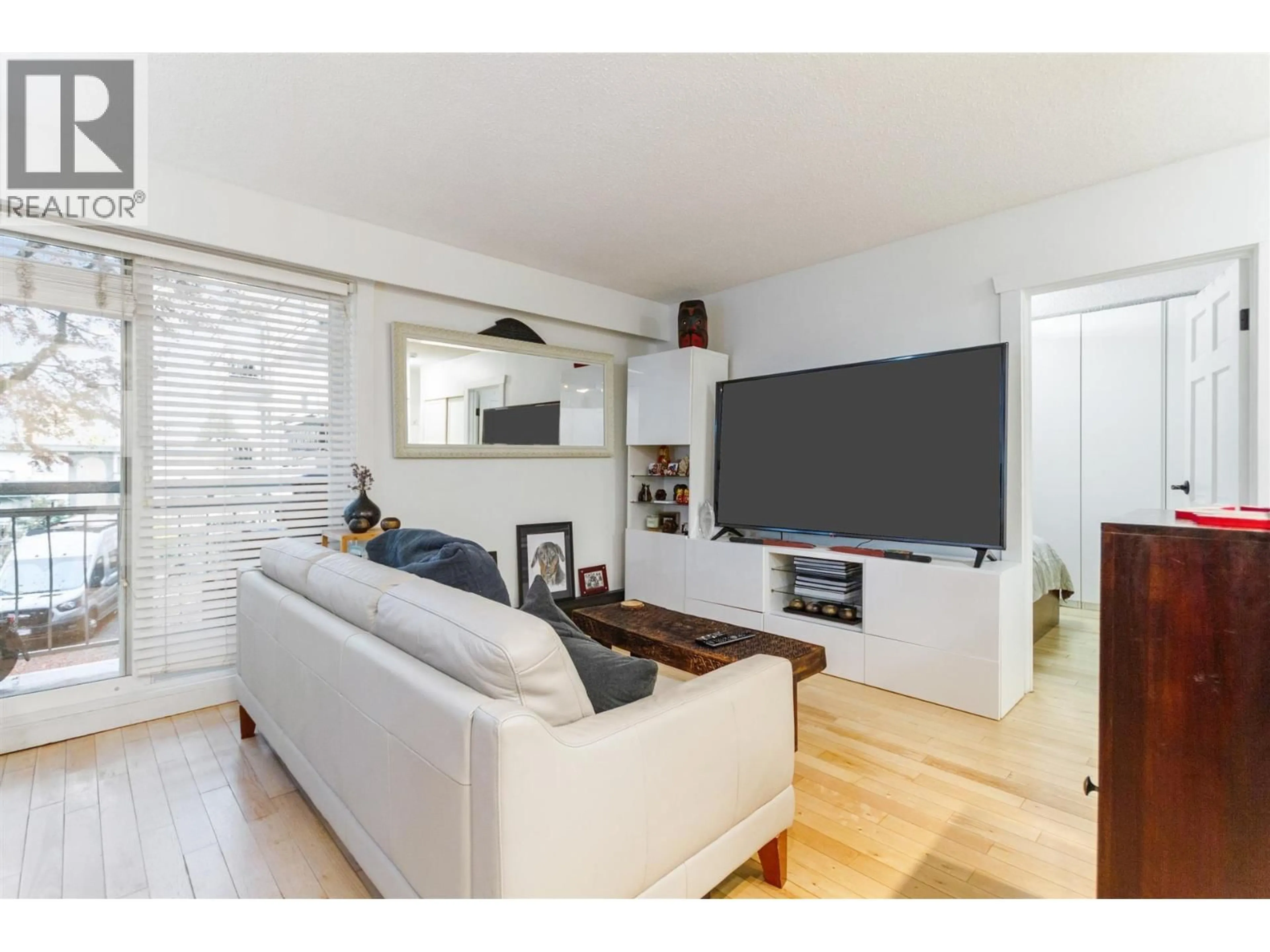 Living room with furniture, wood/laminate floor for 213 - 711 6TH AVENUE, Vancouver British Columbia V5T1L7