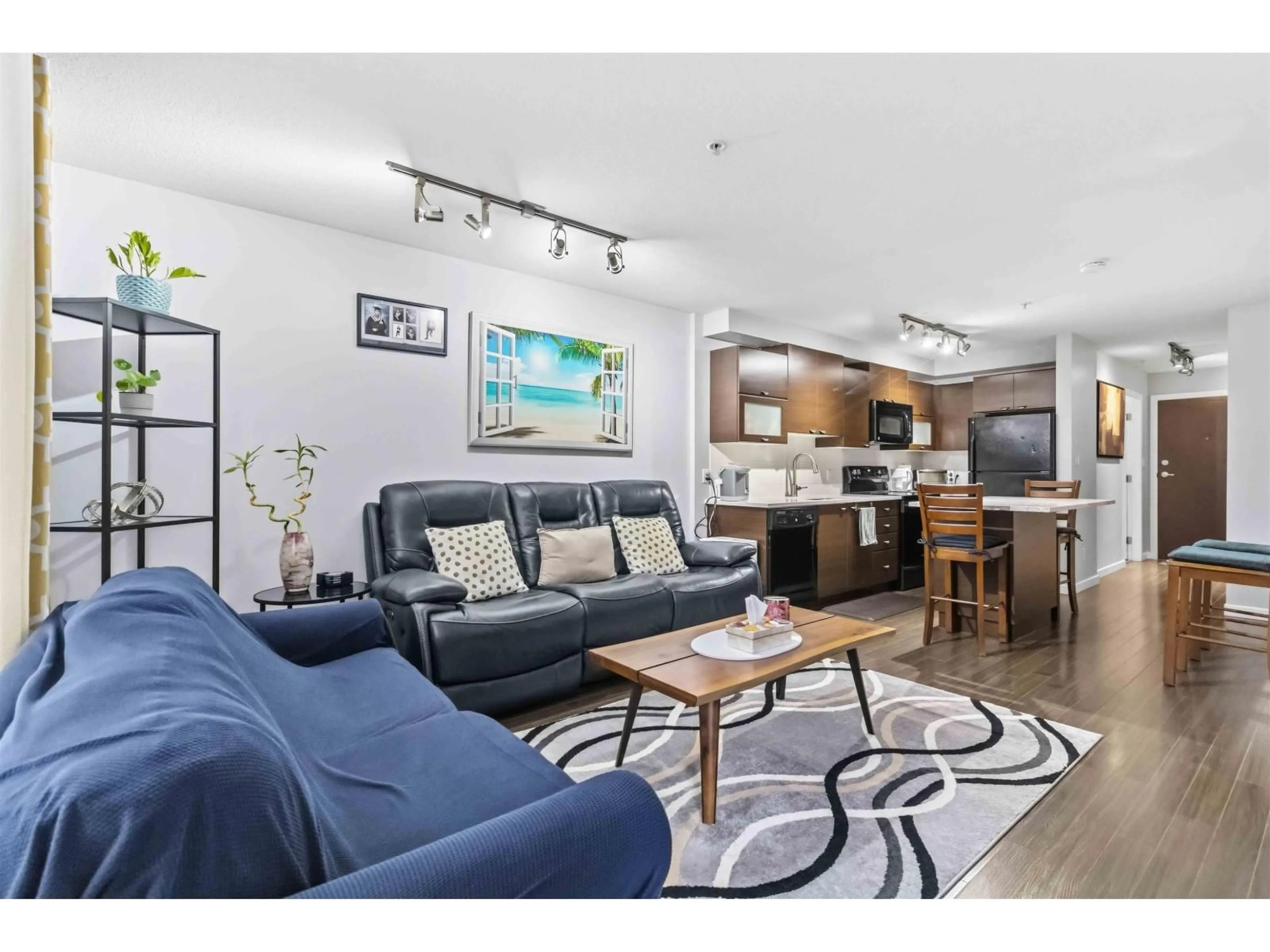 Living room with furniture, wood/laminate floor for 124 - 10707 139, Surrey British Columbia V3T0B2