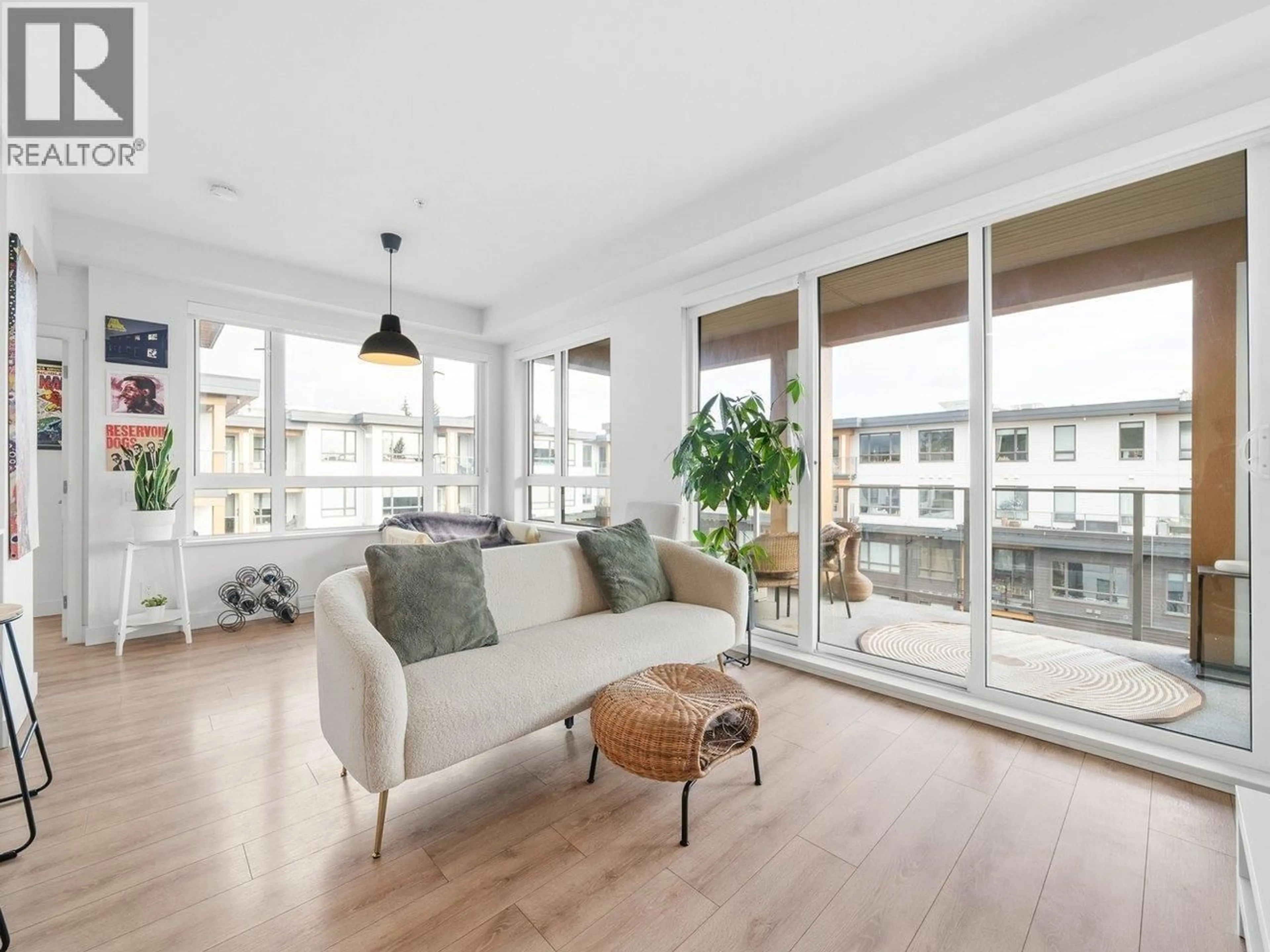 Living room with furniture, wood/laminate floor for 613 - 735 ANSKAR COURT, Coquitlam British Columbia V3J0L7