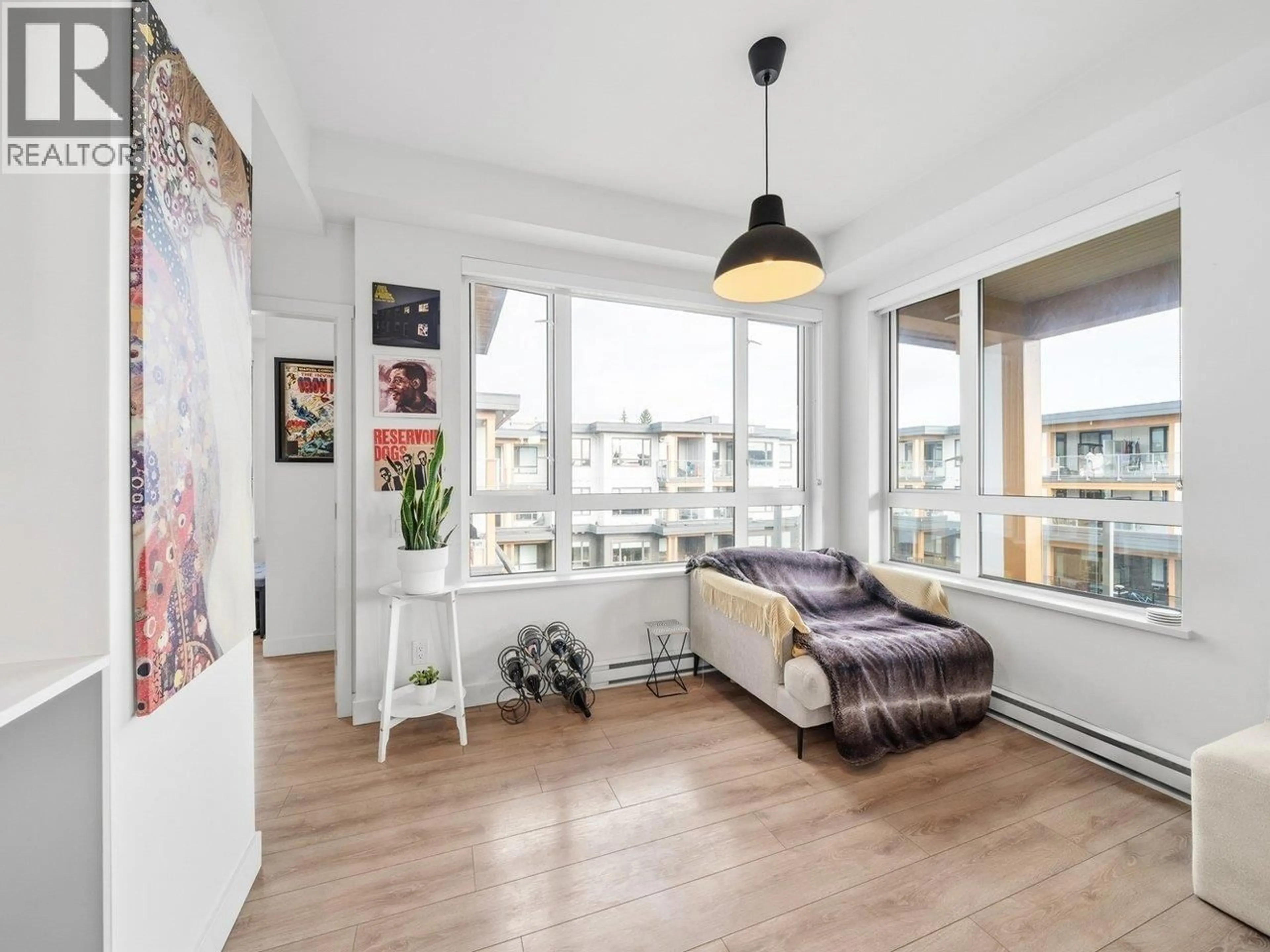 Living room with furniture, wood/laminate floor for 613 - 735 ANSKAR COURT, Coquitlam British Columbia V3J0L7