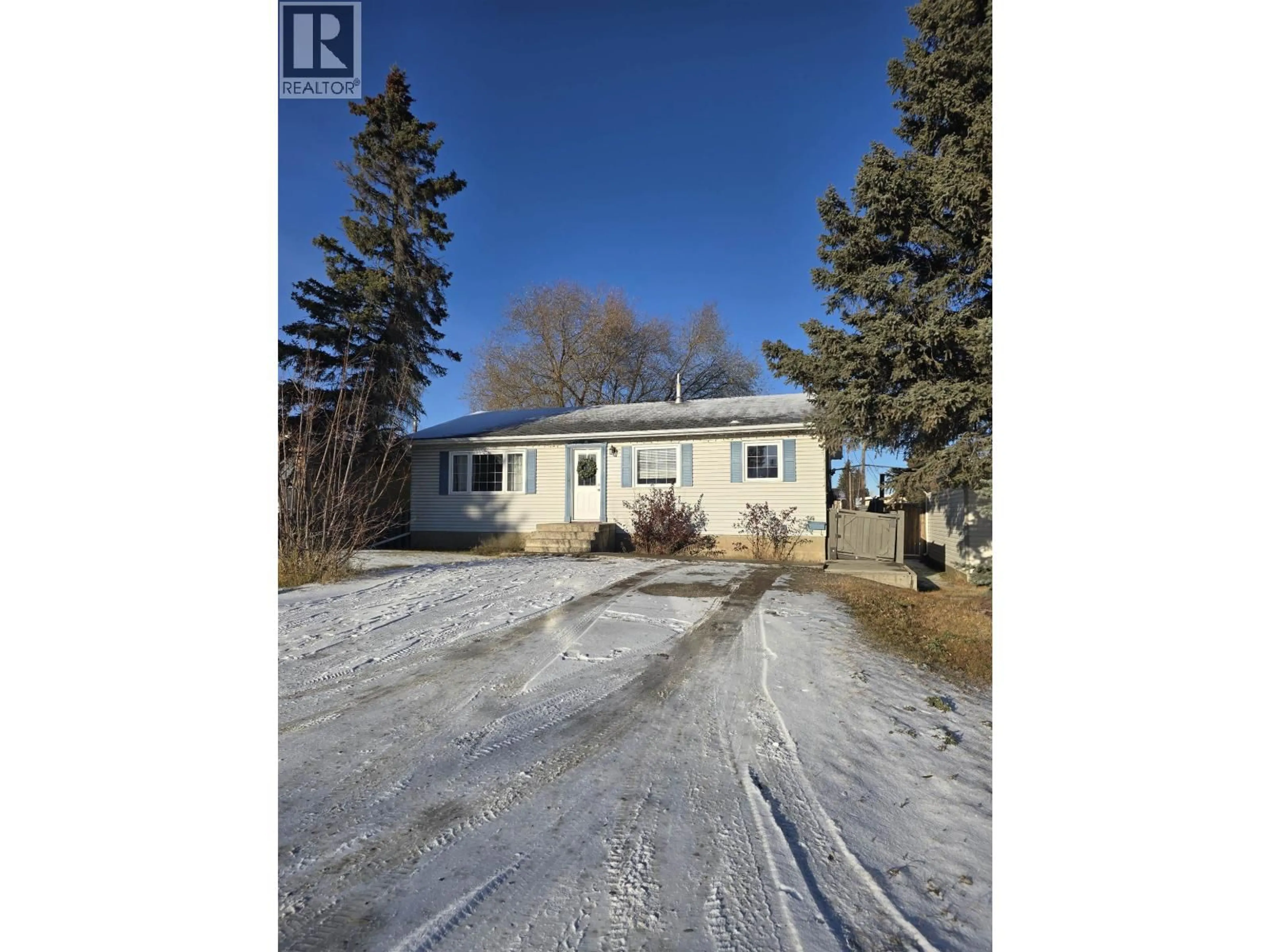 A pic from outside/outdoor area/front of a property/back of a property/a pic from drone, street for 9104 101 AVENUE, Fort St. John British Columbia V1J2A6