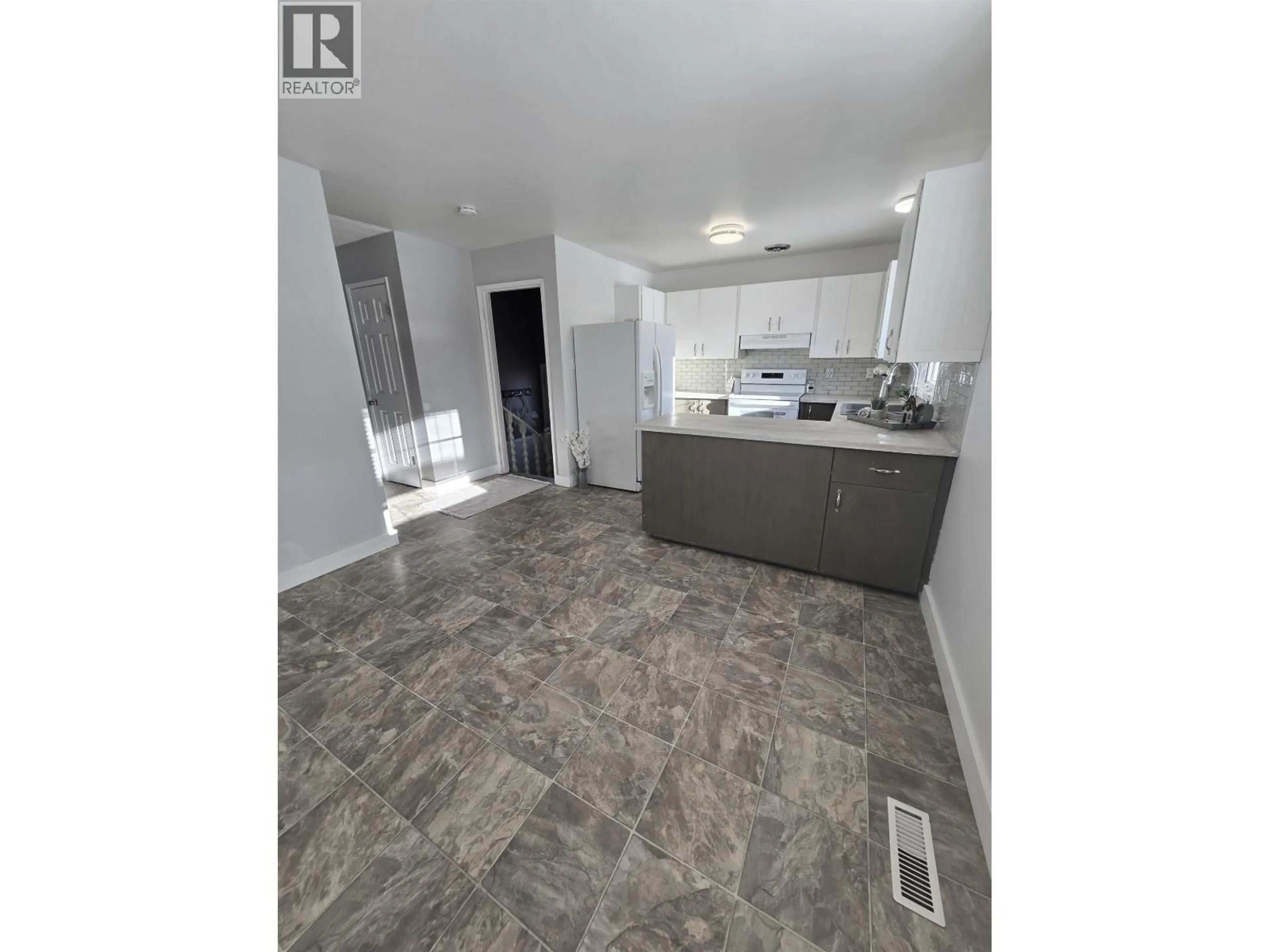 Open concept kitchen, ceramic/tile floor for 9104 101 AVENUE, Fort St. John British Columbia V1J2A6