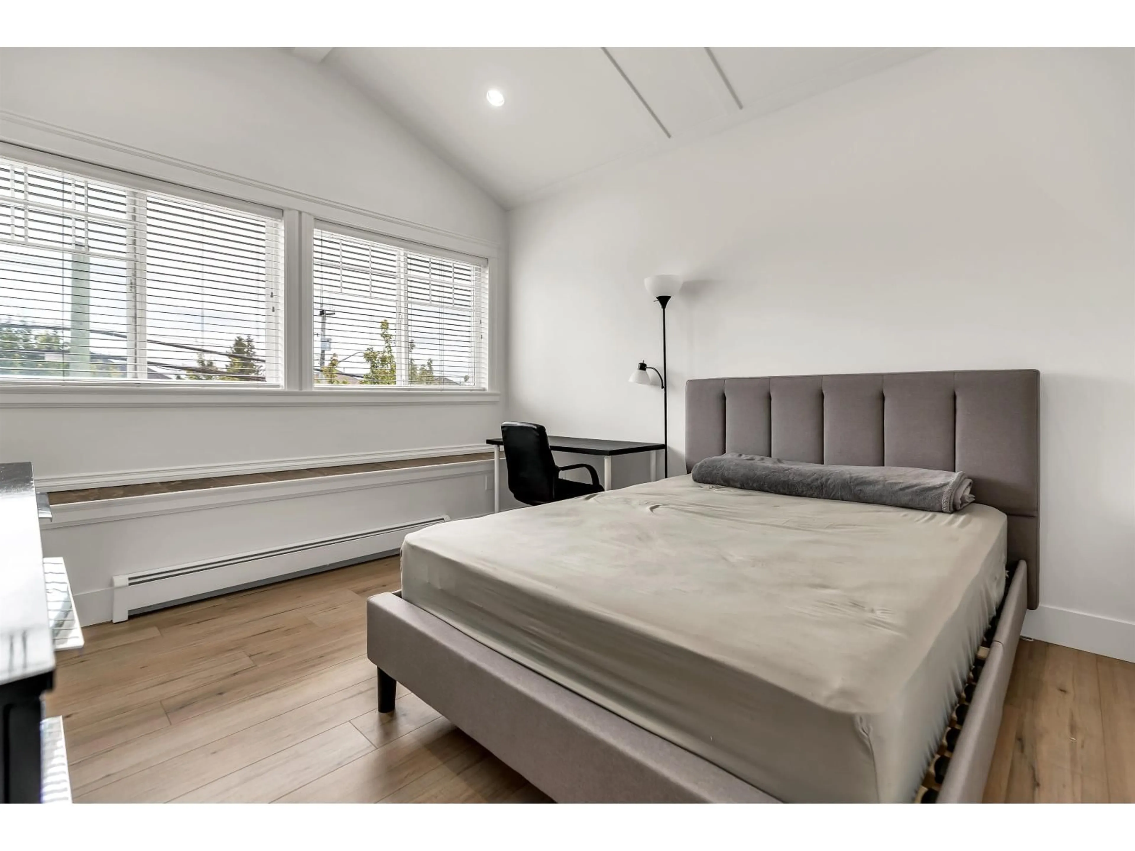 Bedroom with bed, wood/laminate floor for 14838 72 AVENUE, Surrey British Columbia V3S2G1