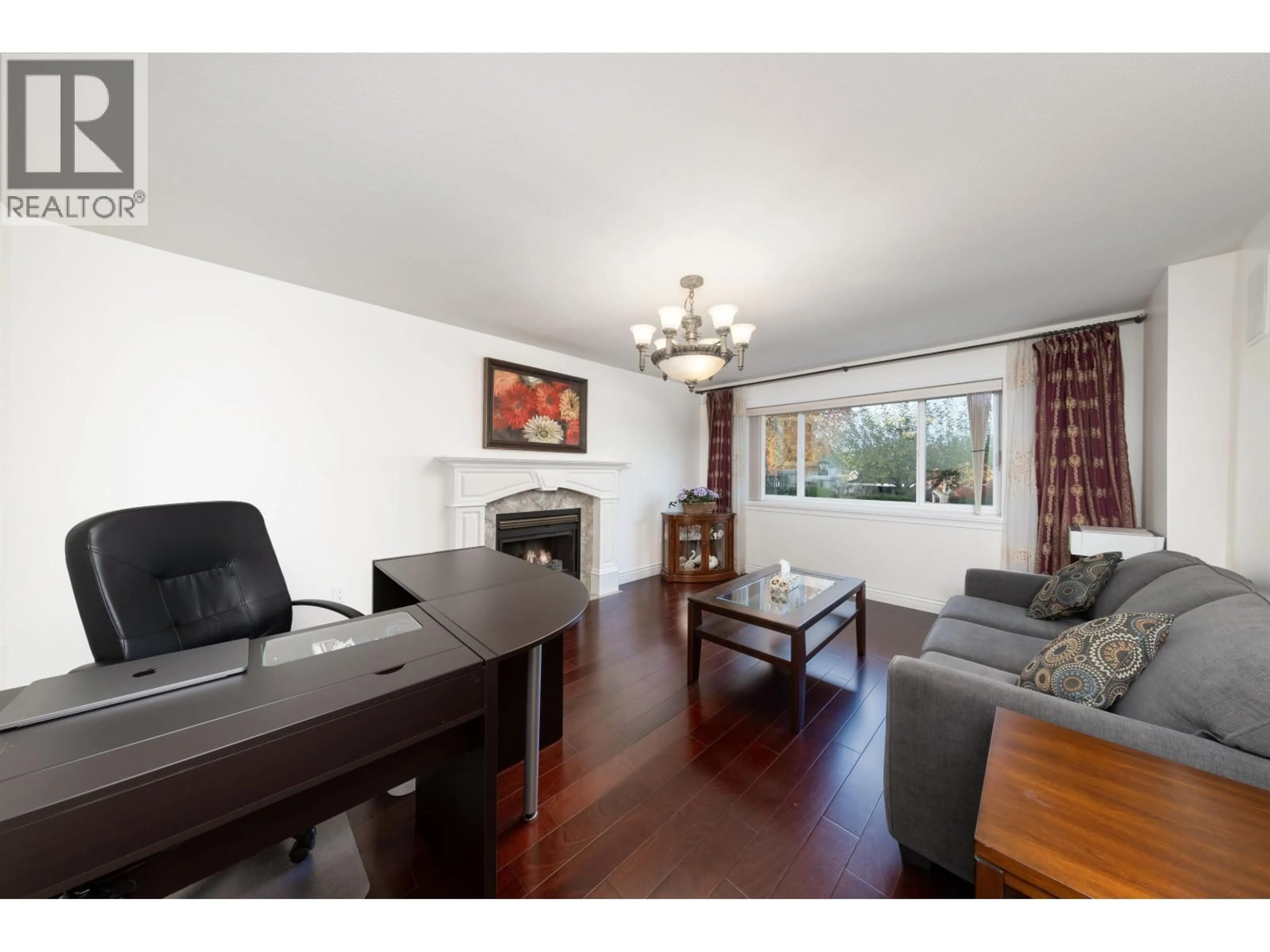 Living room with furniture, wood/laminate floor for 7790 ALLMAN STREET, Burnaby British Columbia V5E2B1