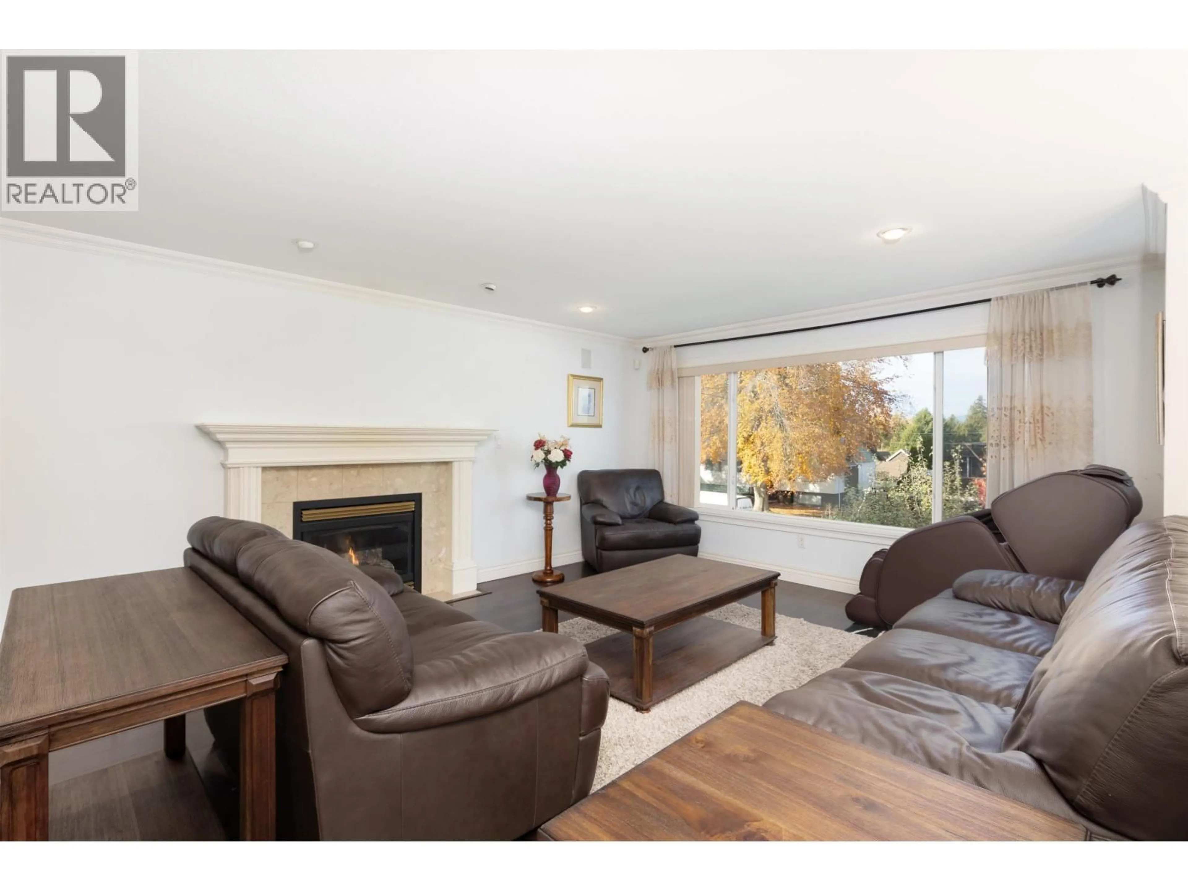 Living room with furniture, wood/laminate floor for 7790 ALLMAN STREET, Burnaby British Columbia V5E2B1