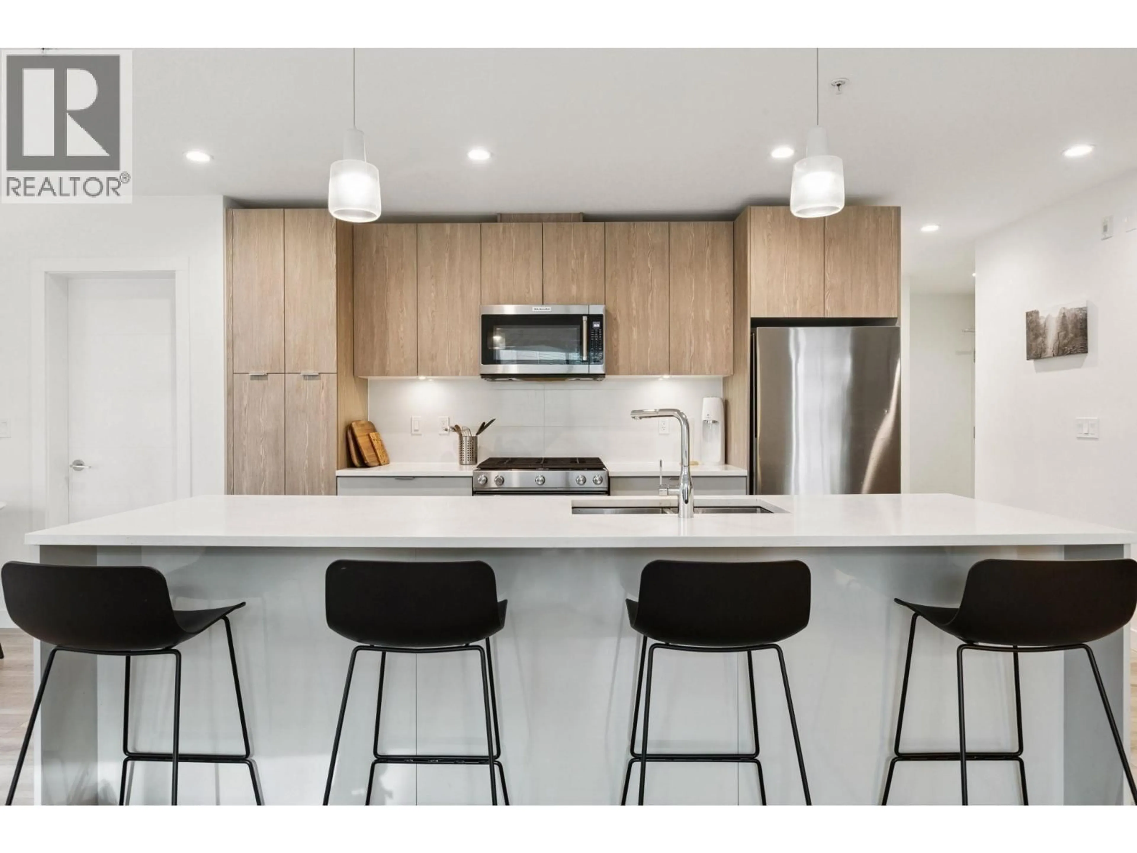 Open concept kitchen, unknown for 309 - 128 8TH STREET, North Vancouver British Columbia V7L0H2