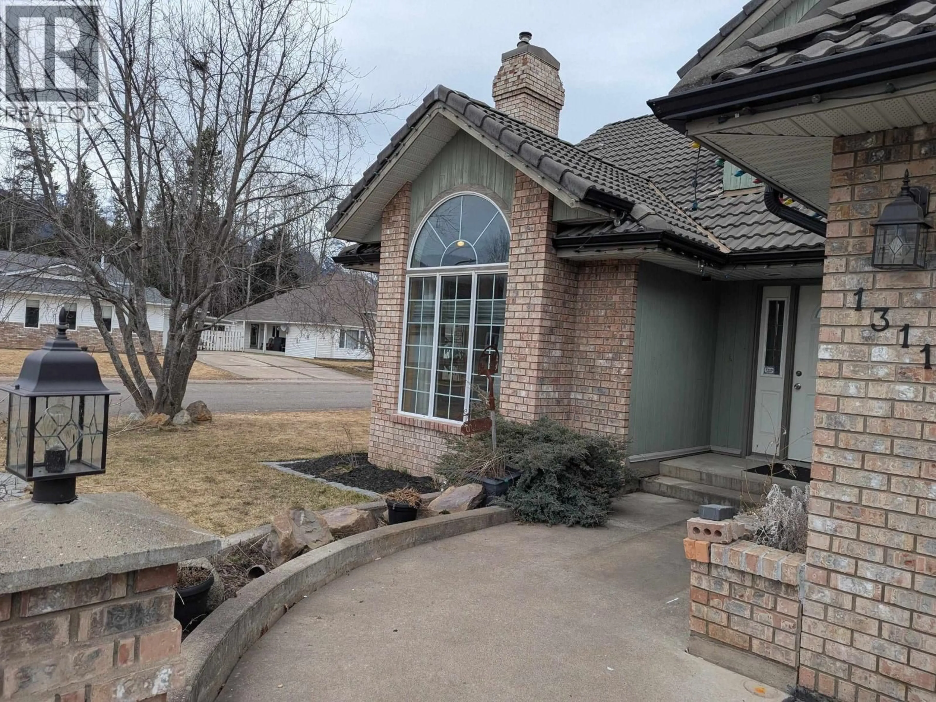 Home with brick exterior material, unknown for 1311 LAGOPUS PLACE, Smithers British Columbia V0J2N0