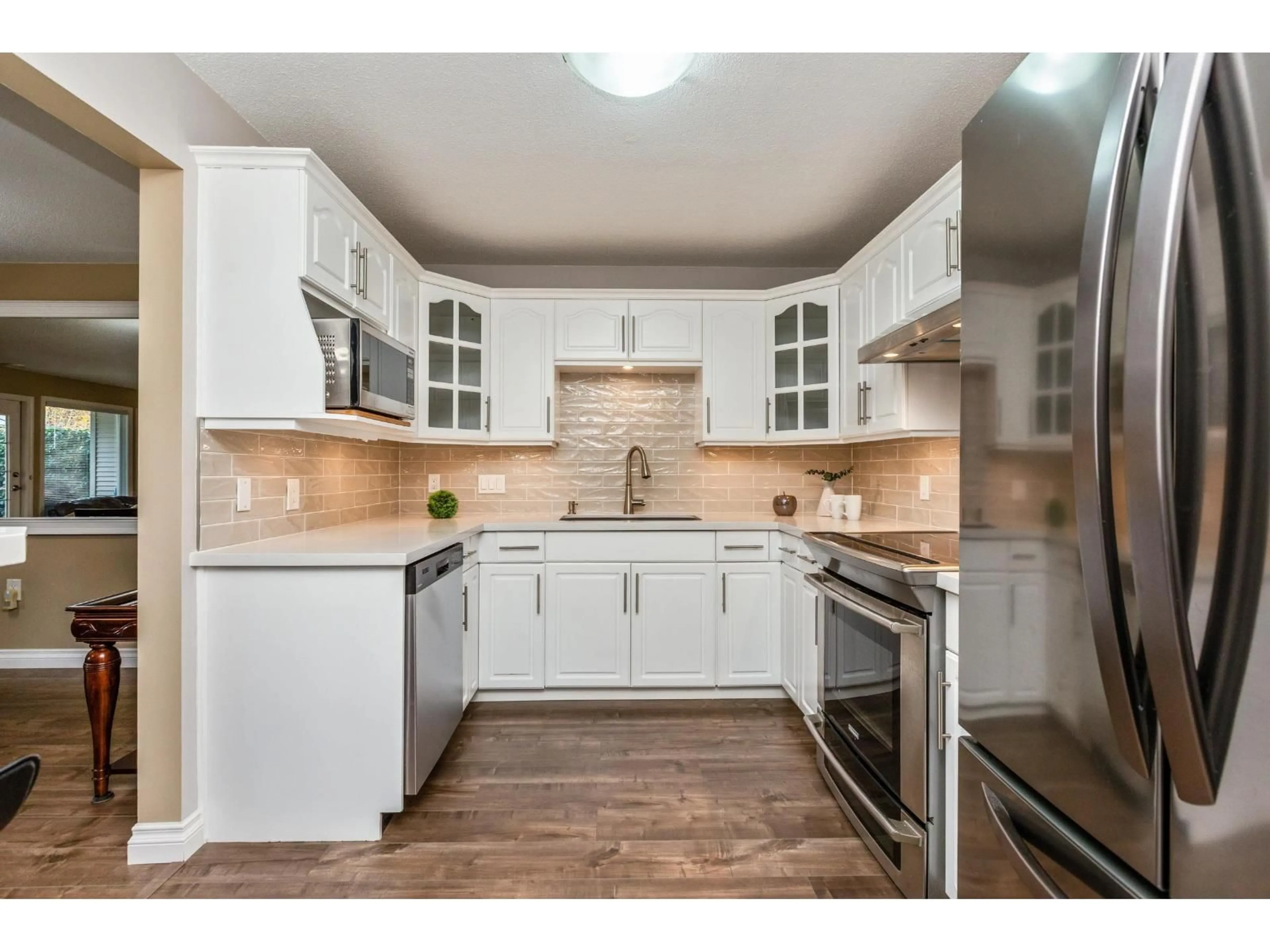 Open concept kitchen, unknown for 103 - 17740 58A, Surrey British Columbia V3S8M5