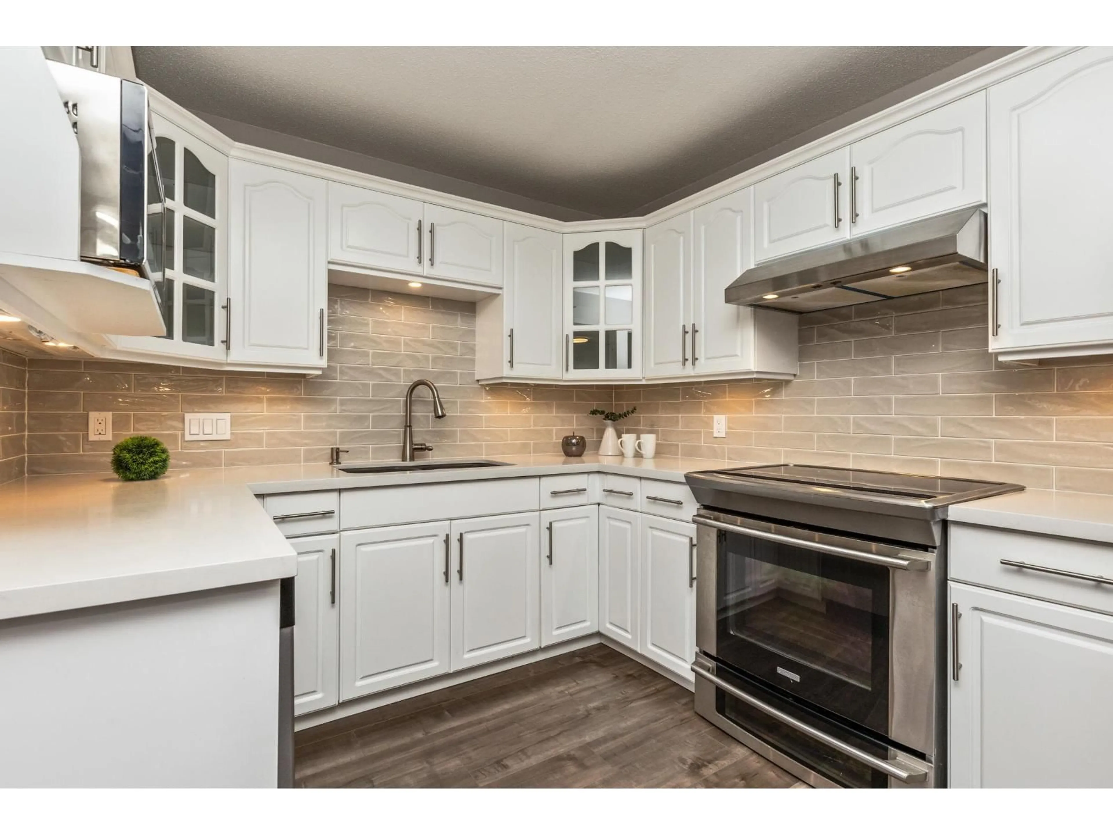 Open concept kitchen, ceramic/tile floor for 103 - 17740 58A, Surrey British Columbia V3S8M5