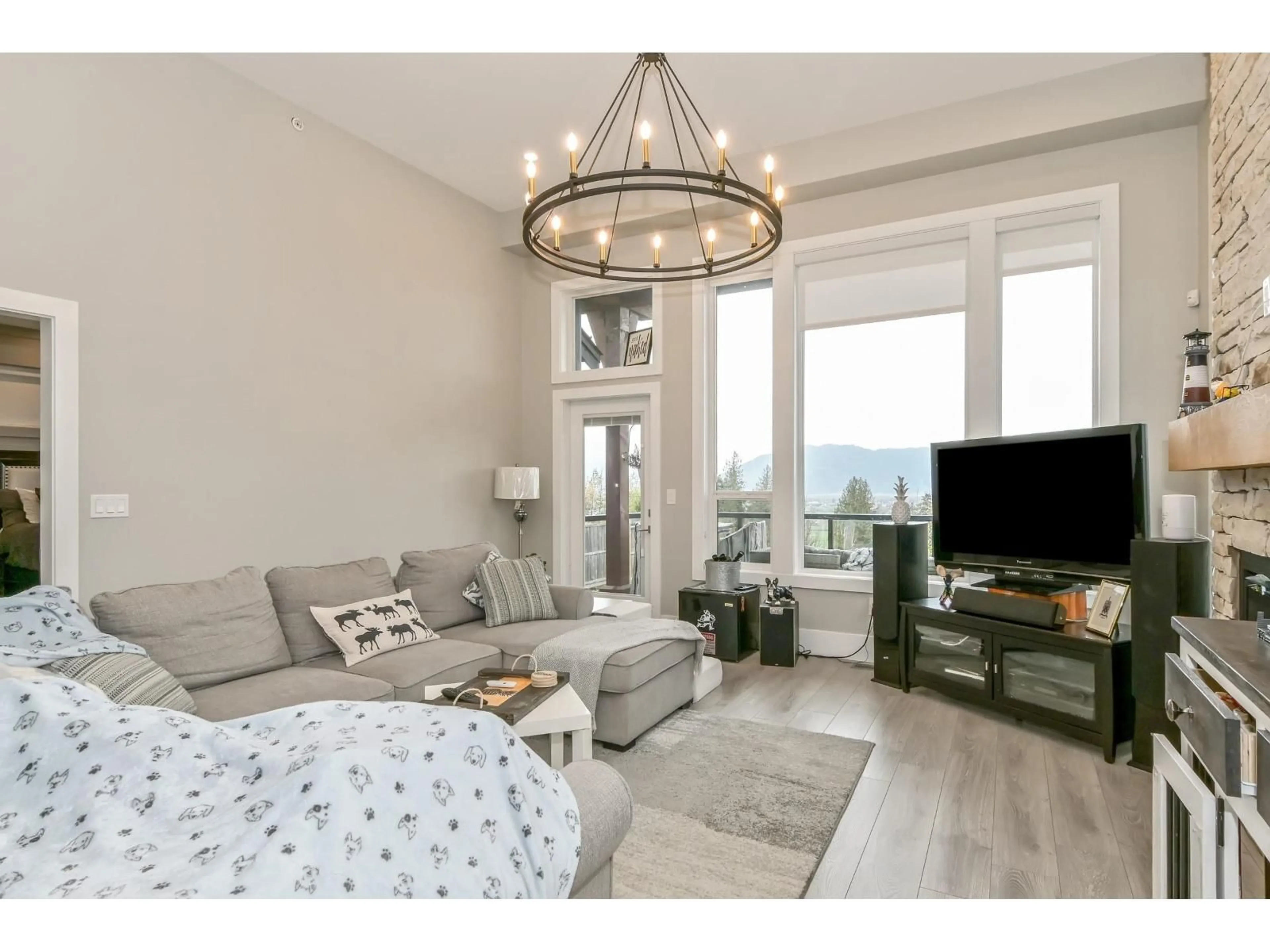 Living room with furniture, wood/laminate floor for 27 - 8295 NIXON ROAD, Chilliwack British Columbia V4Z0C8