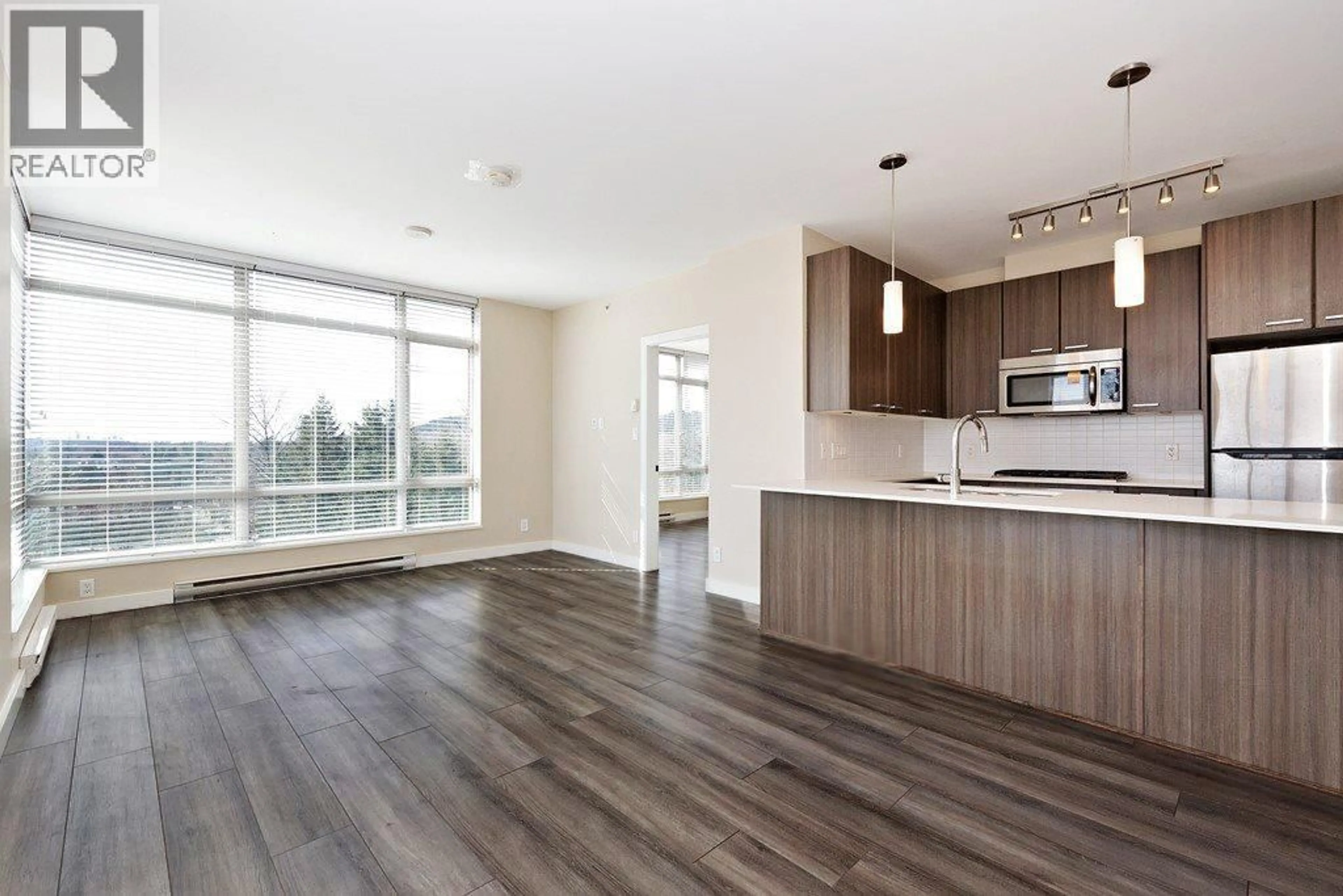 Open concept kitchen, wood/laminate floor for 708 - 2789 SHAUGHNESSY STREET, Port Coquitlam British Columbia V3C3G9