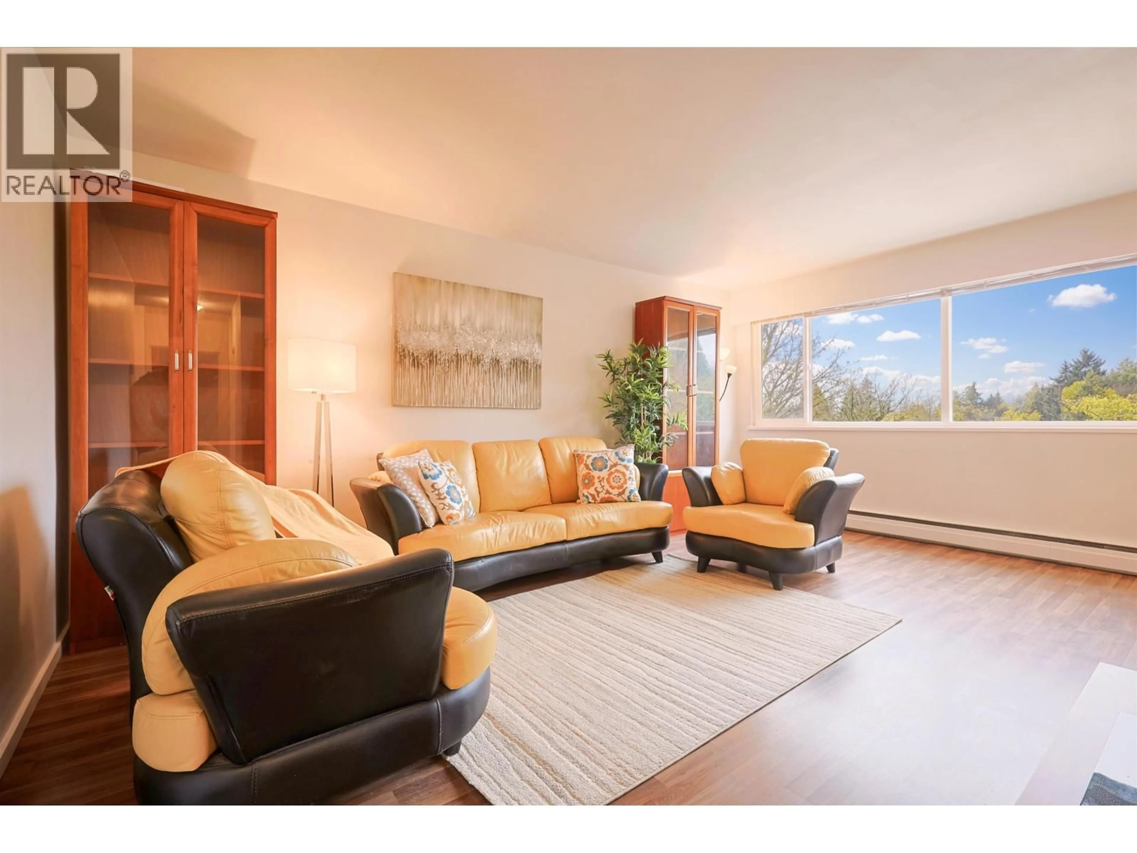 Living room with furniture, wood/laminate floor for 502 - 1750 ESQUIMALT AVENUE, West Vancouver British Columbia V7V1R8