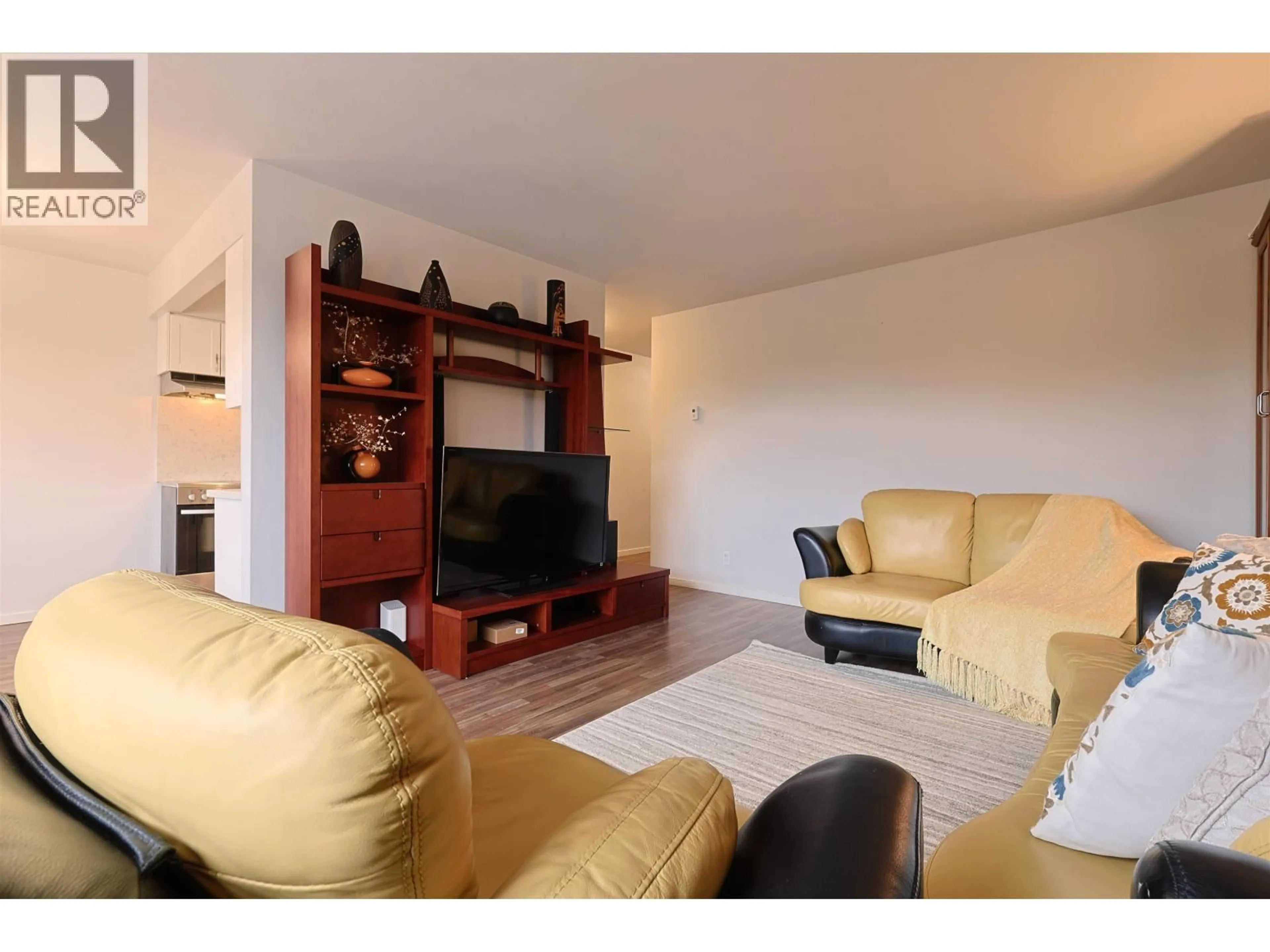 Living room with furniture, wood/laminate floor for 502 - 1750 ESQUIMALT AVENUE, West Vancouver British Columbia V7V1R8