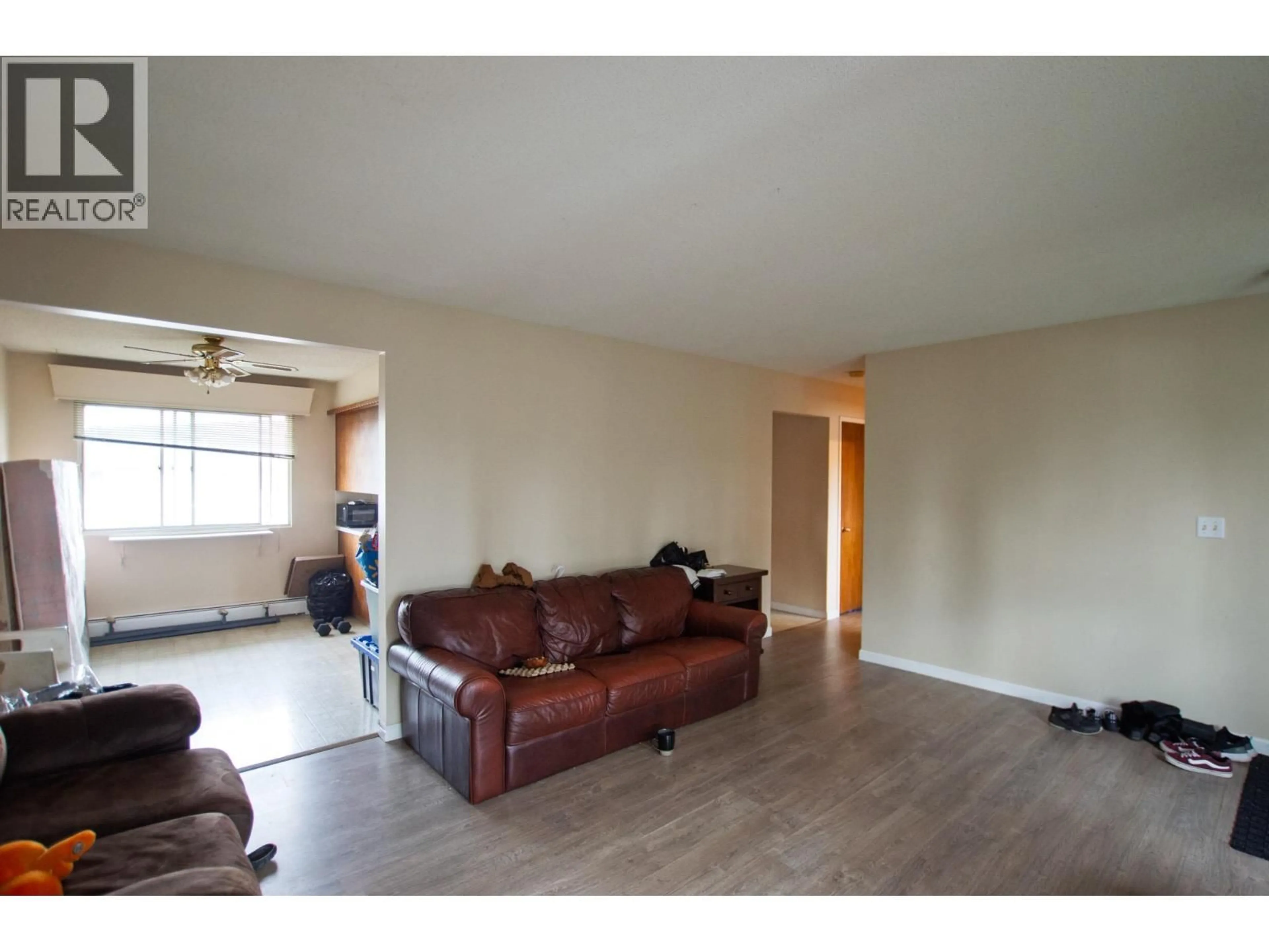 Living room with furniture, wood/laminate floor for 2110 OAK STREET, Prince George British Columbia V2L1Z7