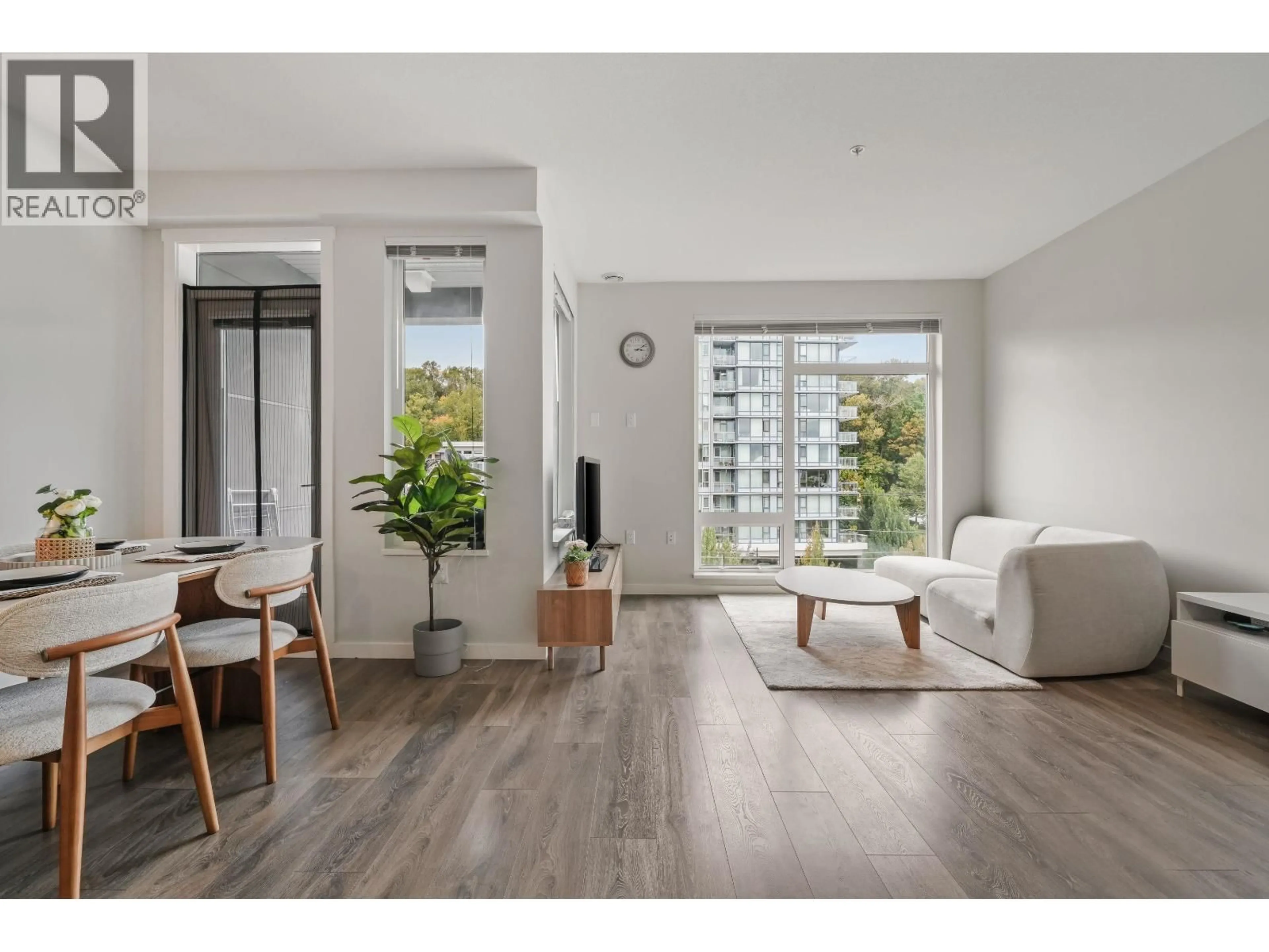 Living room with furniture, wood/laminate floor for 510 - 3289 RIVERWALK AVENUE, Vancouver British Columbia V5S0G2