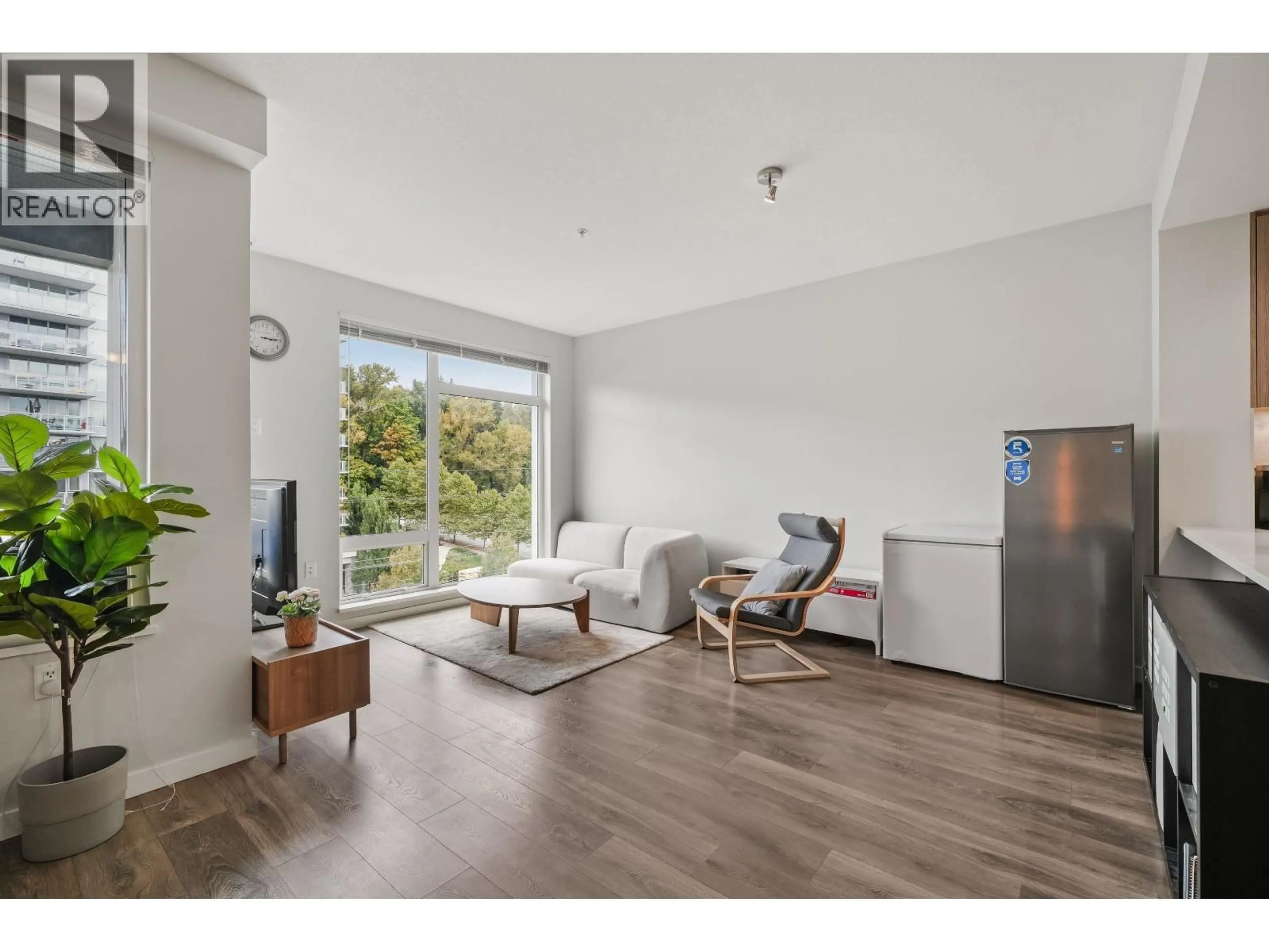 Living room with furniture, wood/laminate floor for 510 - 3289 RIVERWALK AVENUE, Vancouver British Columbia V5S0G2