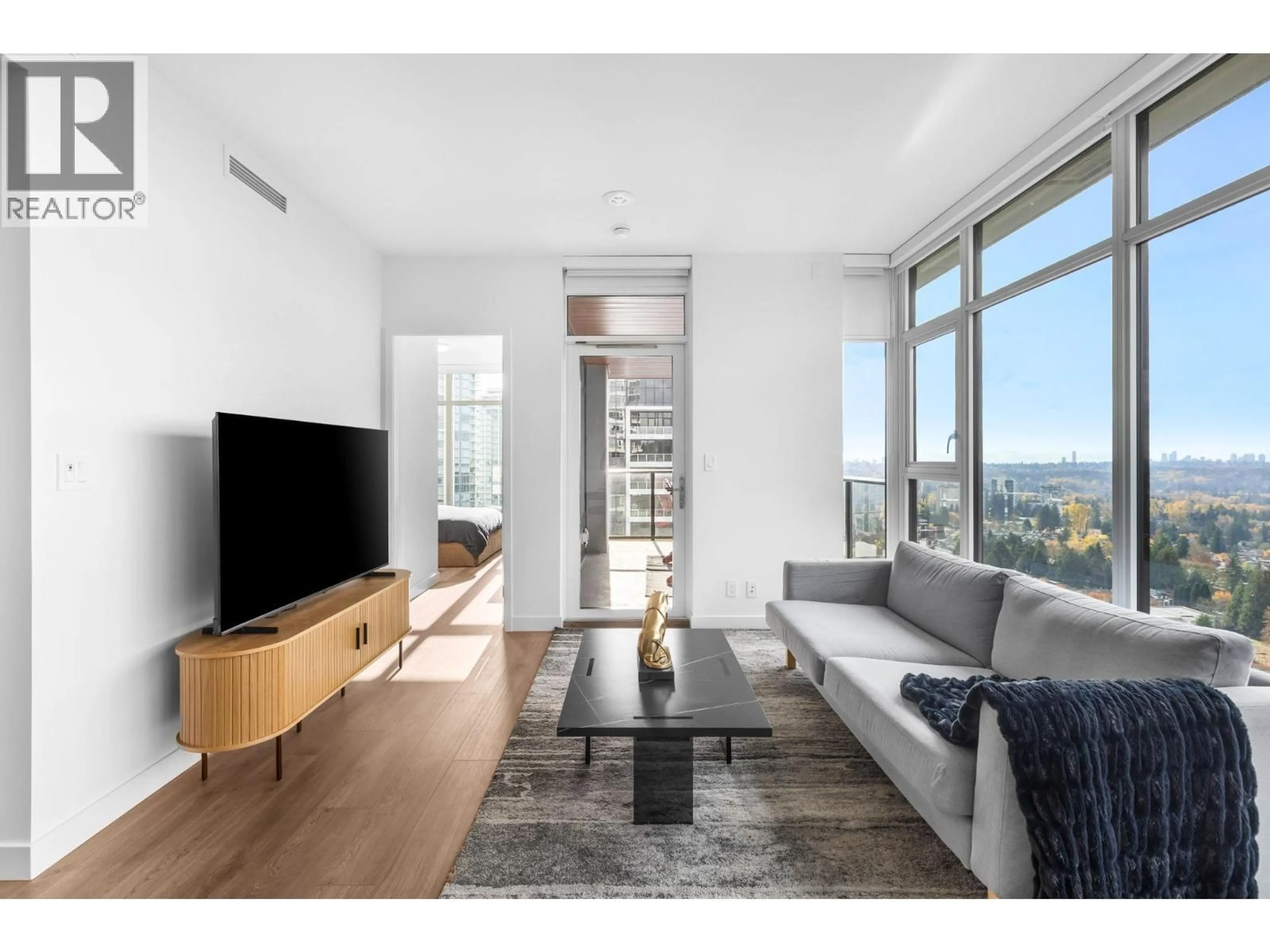 Living room with furniture, wood/laminate floor for 1707 - 720 FARROW STREET, Coquitlam British Columbia V3J0P3