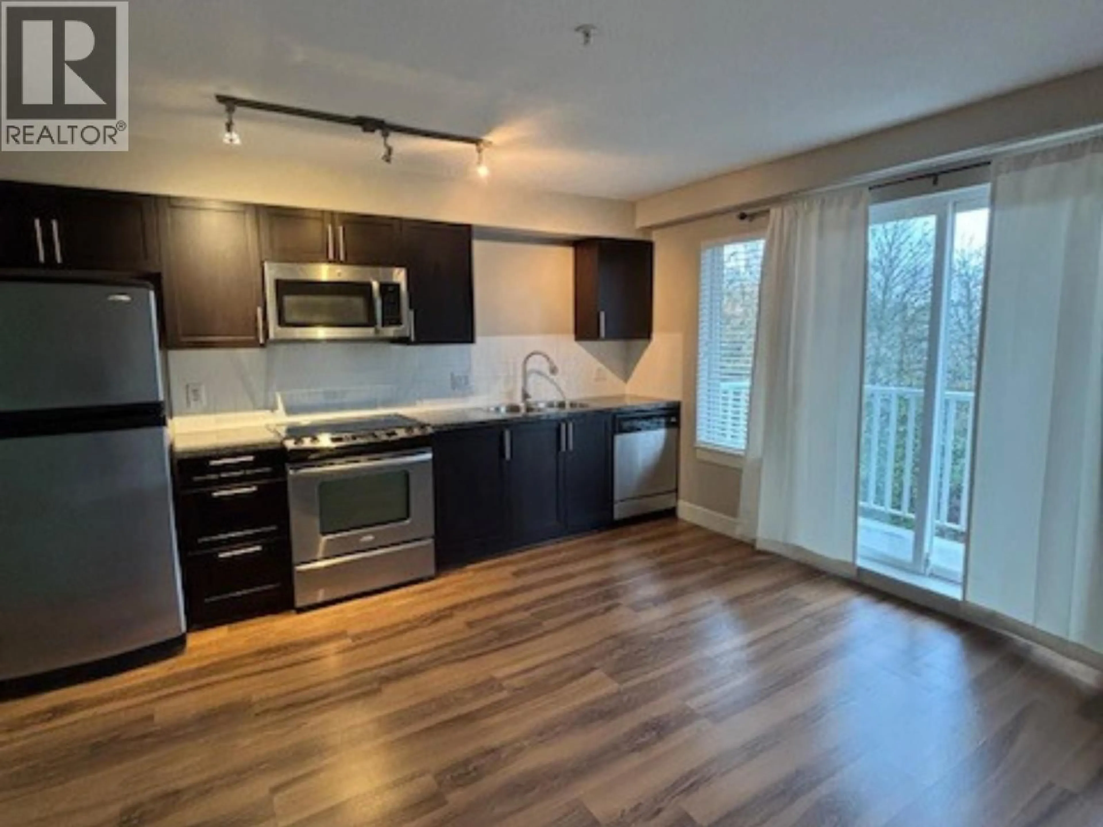 Open concept kitchen, wood/laminate floor for 307 - 12283 224 STREET, Maple Ridge British Columbia V2X8Z3