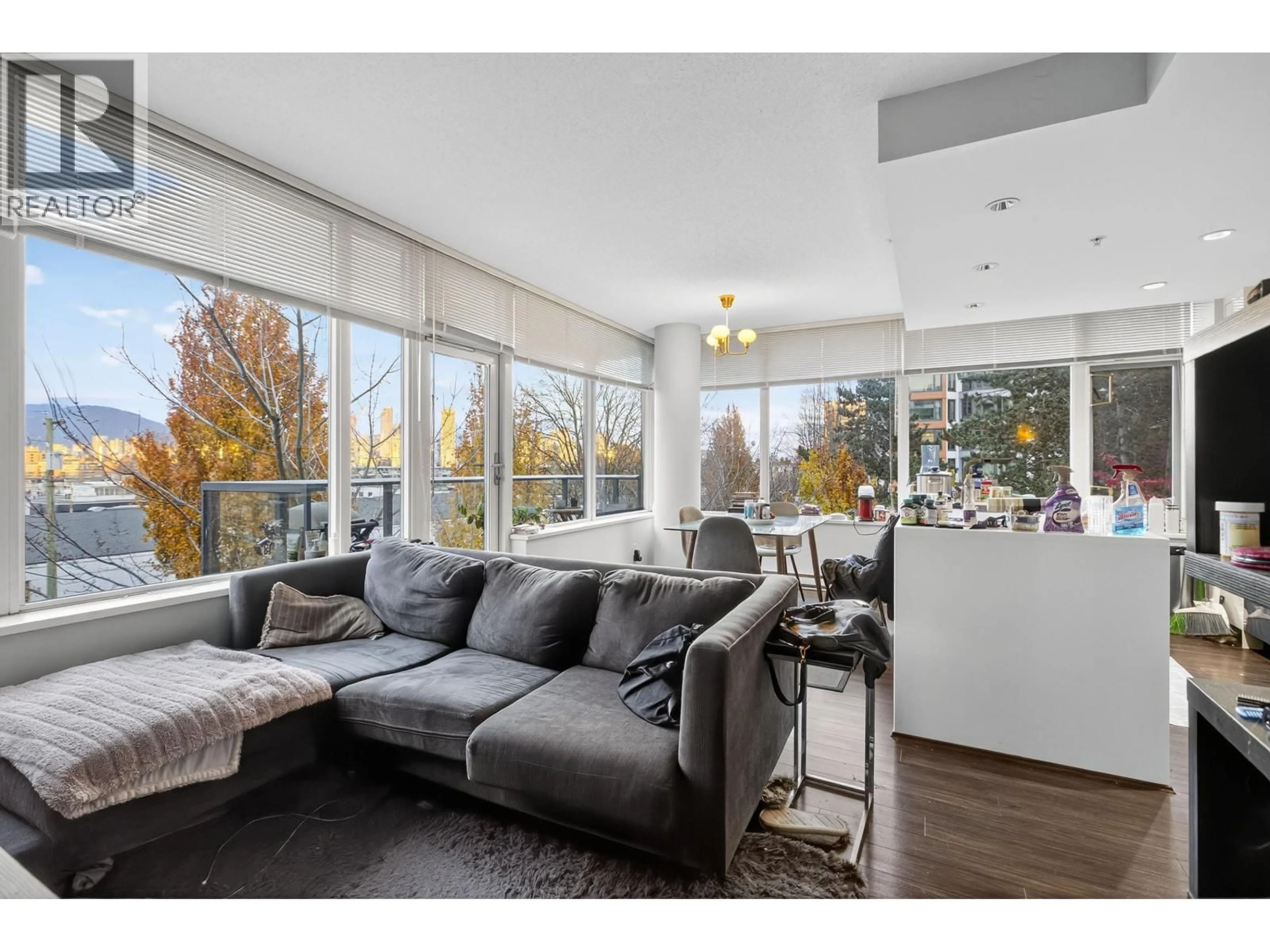 Living room with furniture, wood/laminate floor for 210 - 1777 7TH AVENUE, Vancouver British Columbia V6J0E5