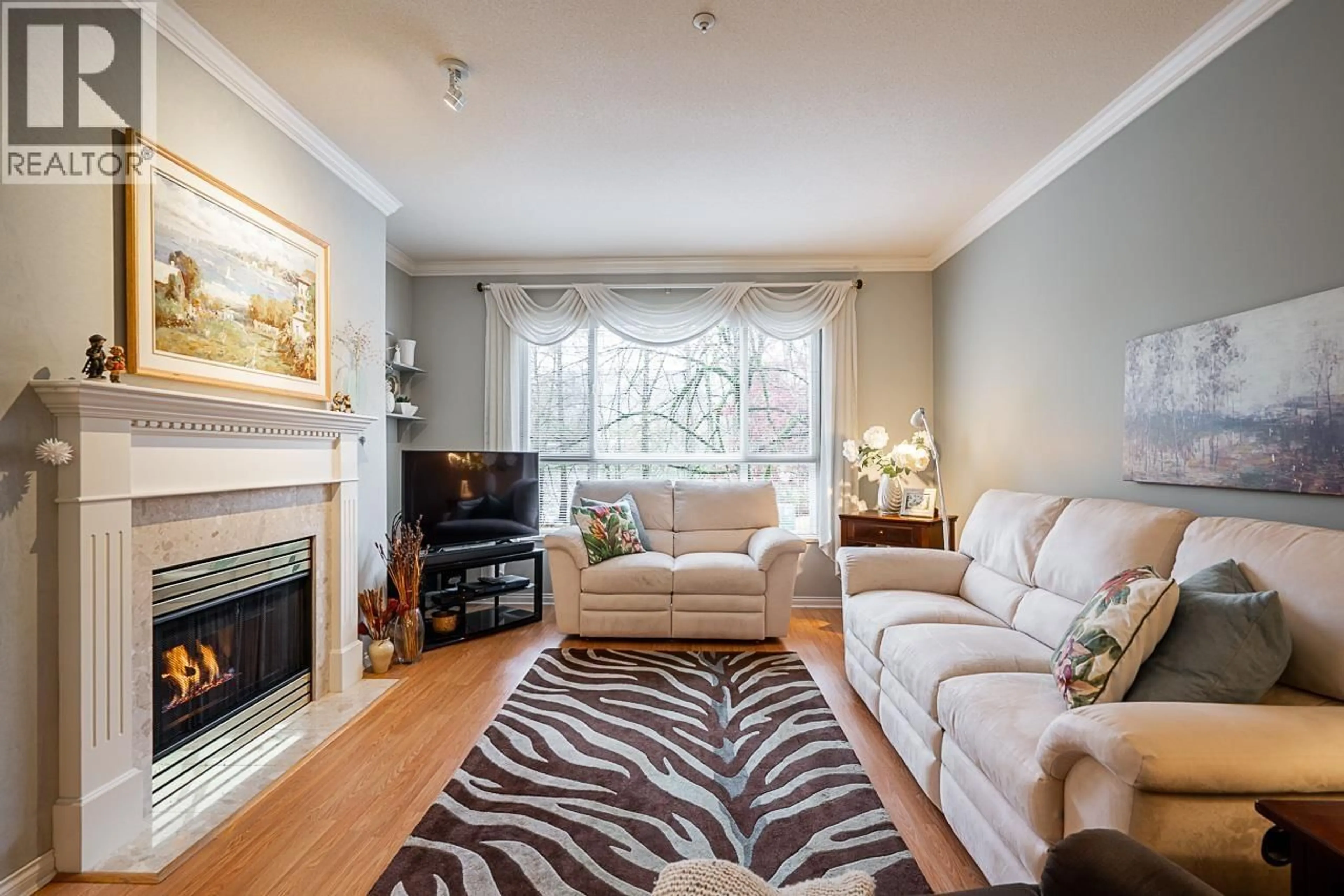 Living room with furniture, unknown for 202 - 3098 GUILDFORD WAY, Coquitlam British Columbia V3B7W8