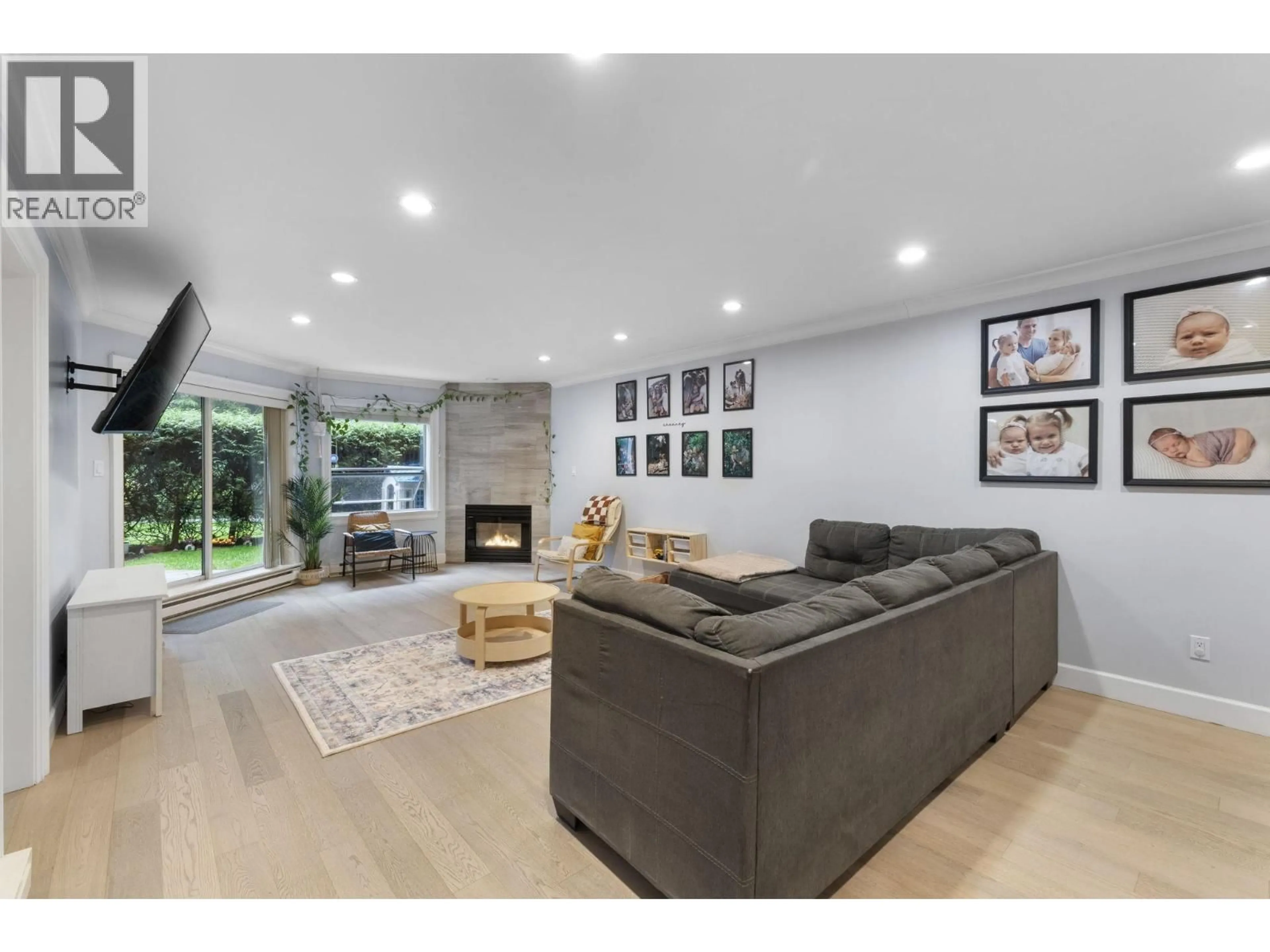 Living room with furniture, unknown for 102 - 1500 OSTLER COURT, North Vancouver British Columbia V7G2S2