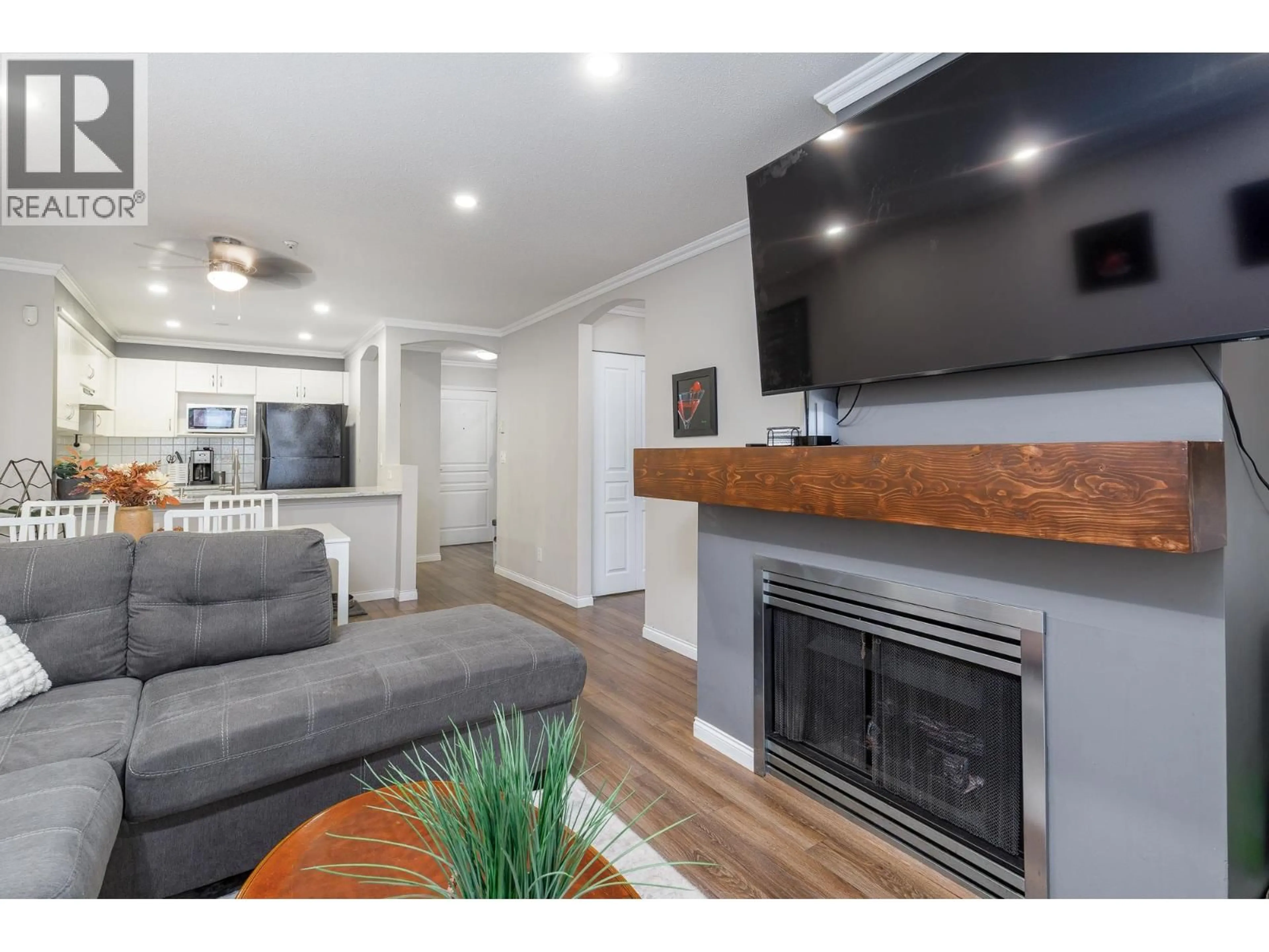 Living room with furniture, wood/laminate floor for 202 - 3033 TERRAVISTA PLACE, Port Moody British Columbia V3H5A3