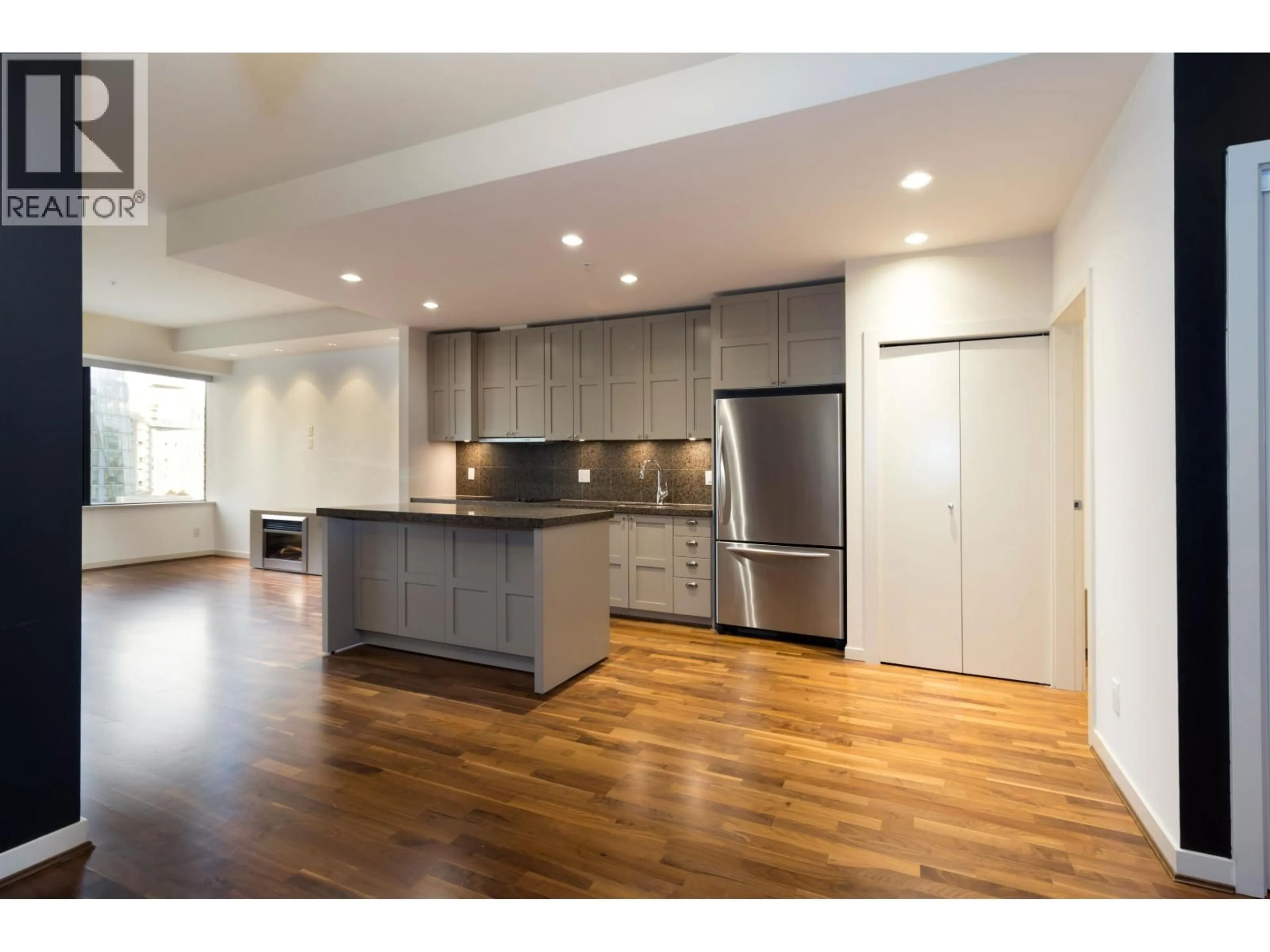Open concept kitchen, wood/laminate floor for 615 - 1333 GEORGIA STREET, Vancouver British Columbia V6E4V3