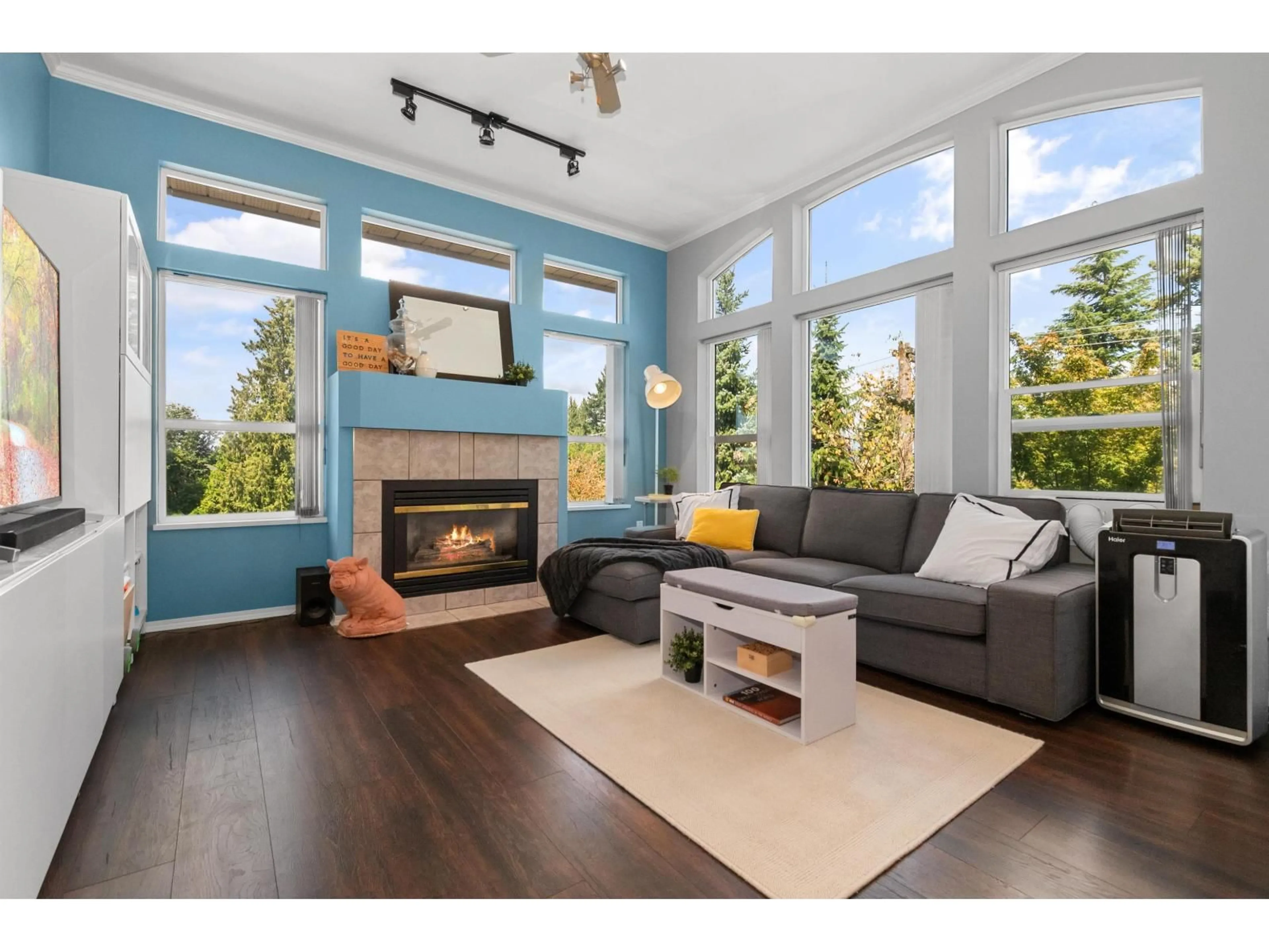 Living room with furniture, wood/laminate floor for 403 - 33480 GEORGE FERGUSON, Abbotsford British Columbia V2S8G1