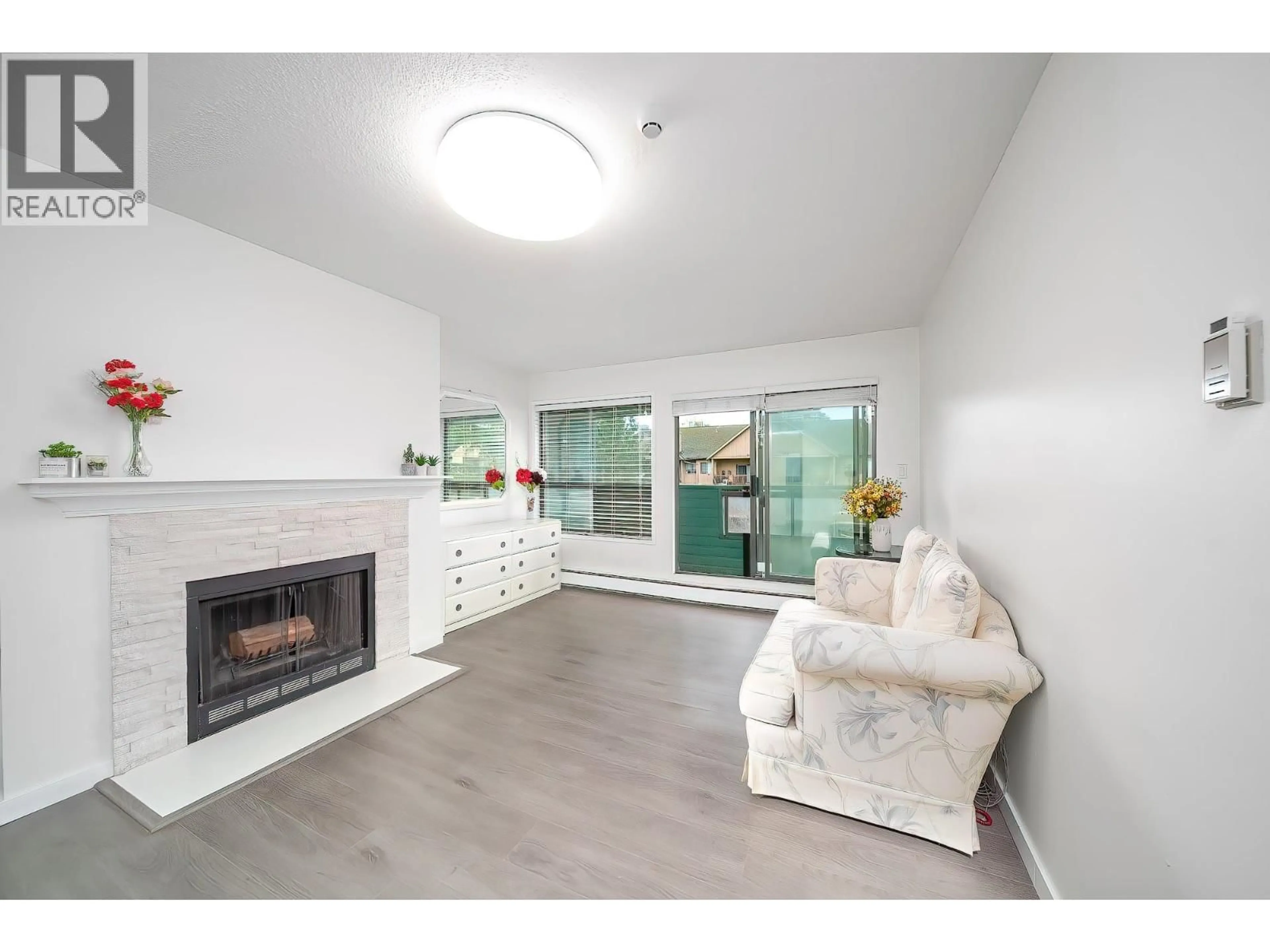 Living room with furniture, wood/laminate floor for 312 - 8591 WESTMINSTER HIGHWAY, Richmond British Columbia V6X3E2