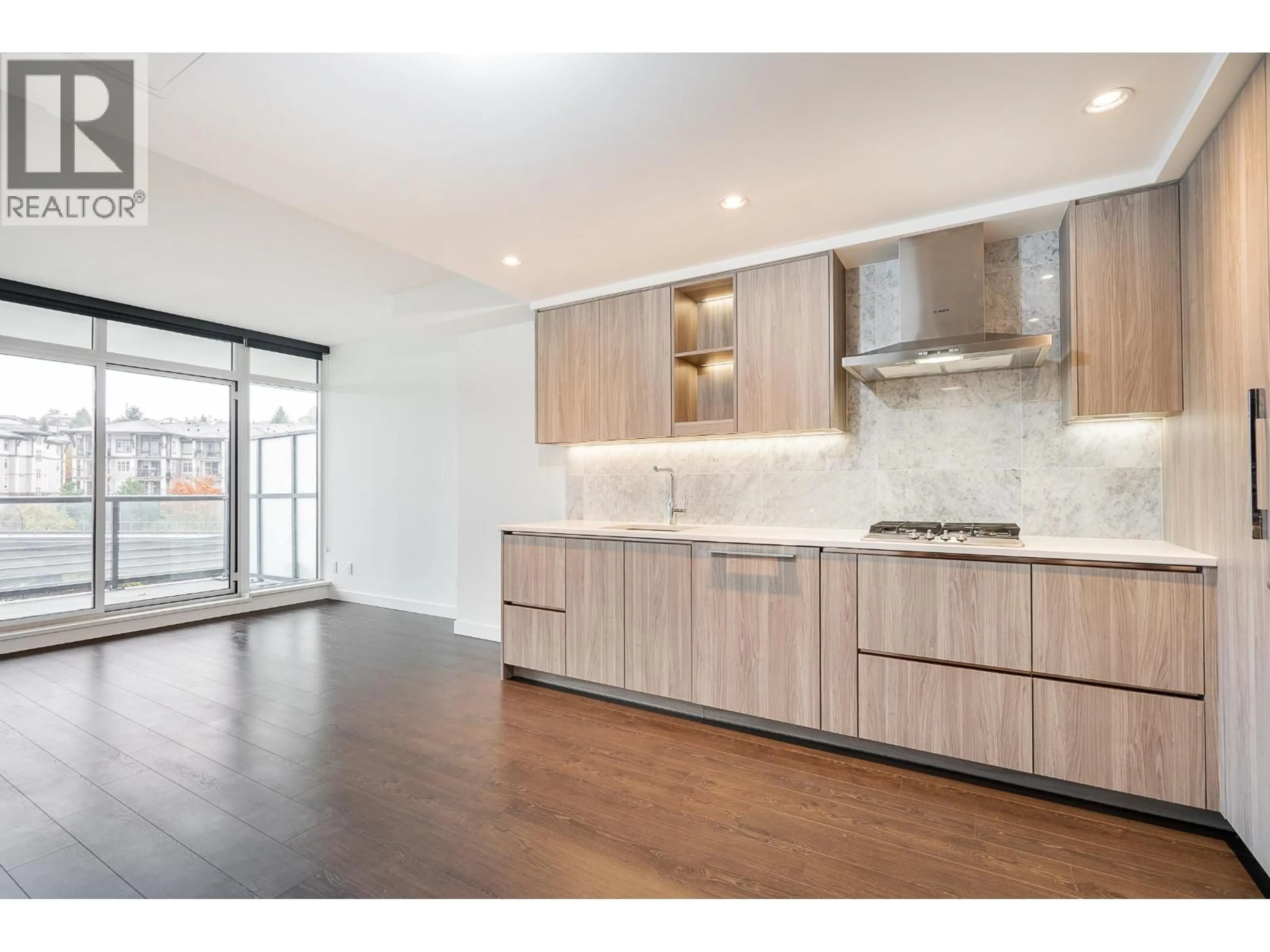 Open concept kitchen, wood/laminate floor for 306 - 4730 LOUGHEED HIGHWAY, Burnaby British Columbia V5C0M9