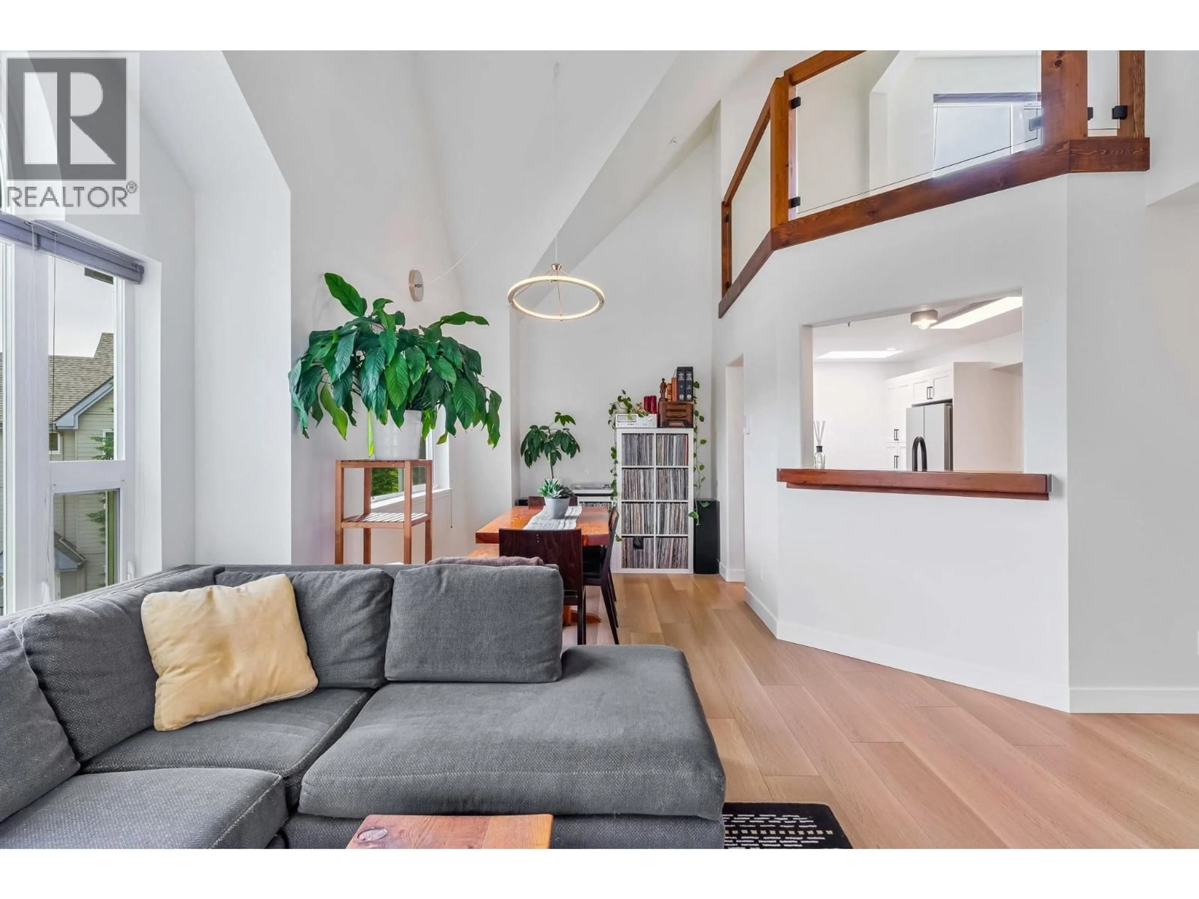 Living room with furniture, wood/laminate floor for 312 - 1466 PEMBERTON AVENUE, Squamish British Columbia V8B0K1