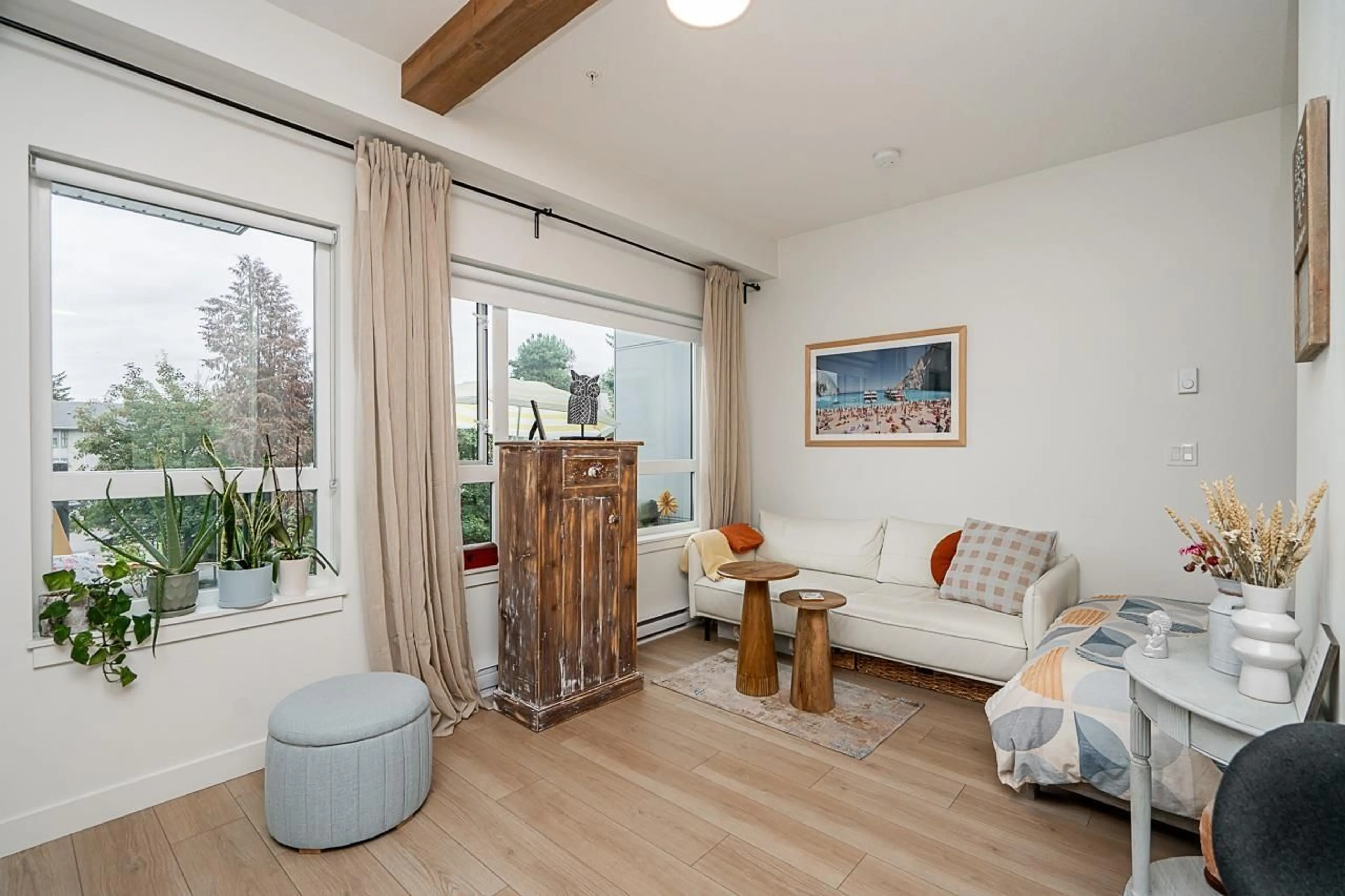 Living room with furniture, wood/laminate floor for 304 - 10777 138, Surrey British Columbia V3T0T5