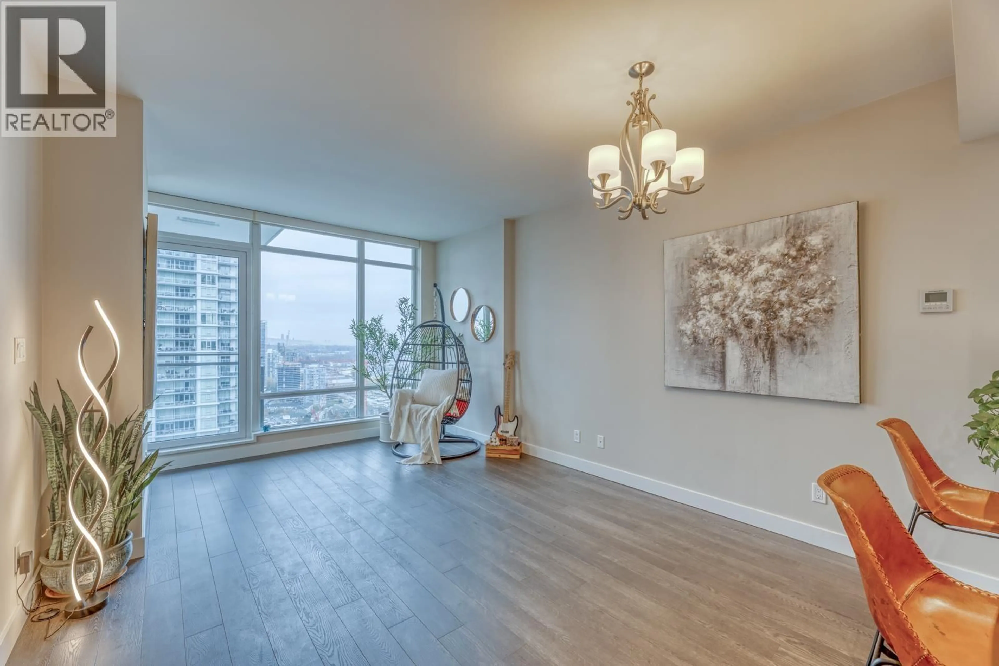 Living room with furniture, wood/laminate floor for 3505 - 2008 ROSSER AVENUE, Burnaby British Columbia V5C0H8