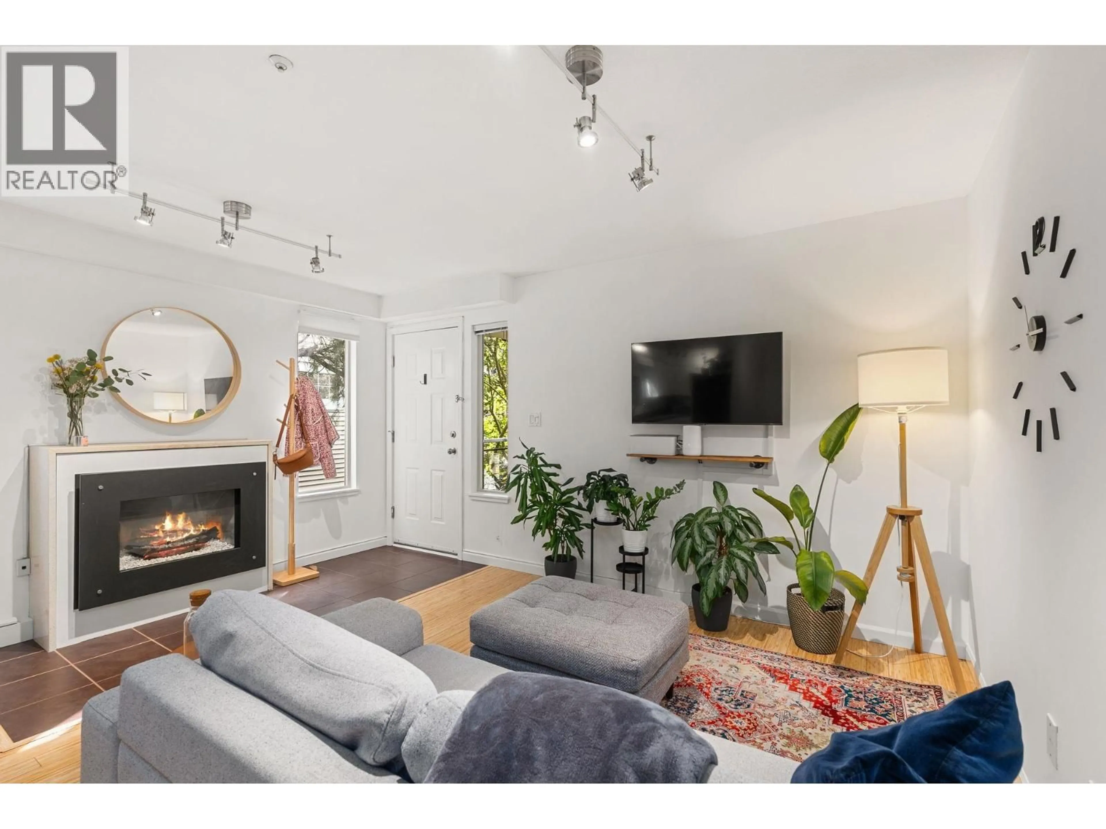 Living room with furniture, wood/laminate floor for 203 - 755 15TH AVENUE, Vancouver British Columbia V5Z1R6