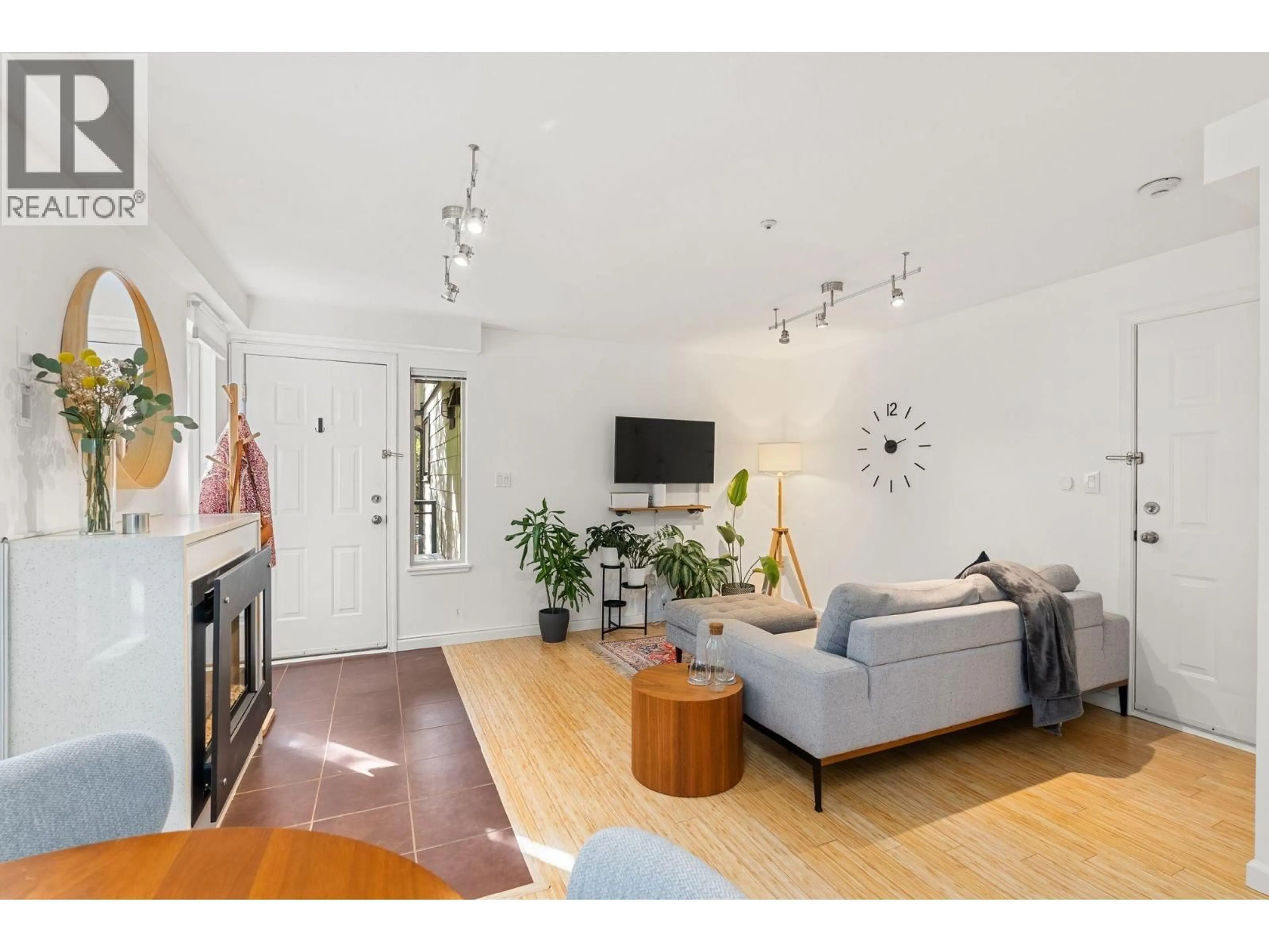 Living room with furniture, wood/laminate floor for 203 - 755 15TH AVENUE, Vancouver British Columbia V5Z1R6