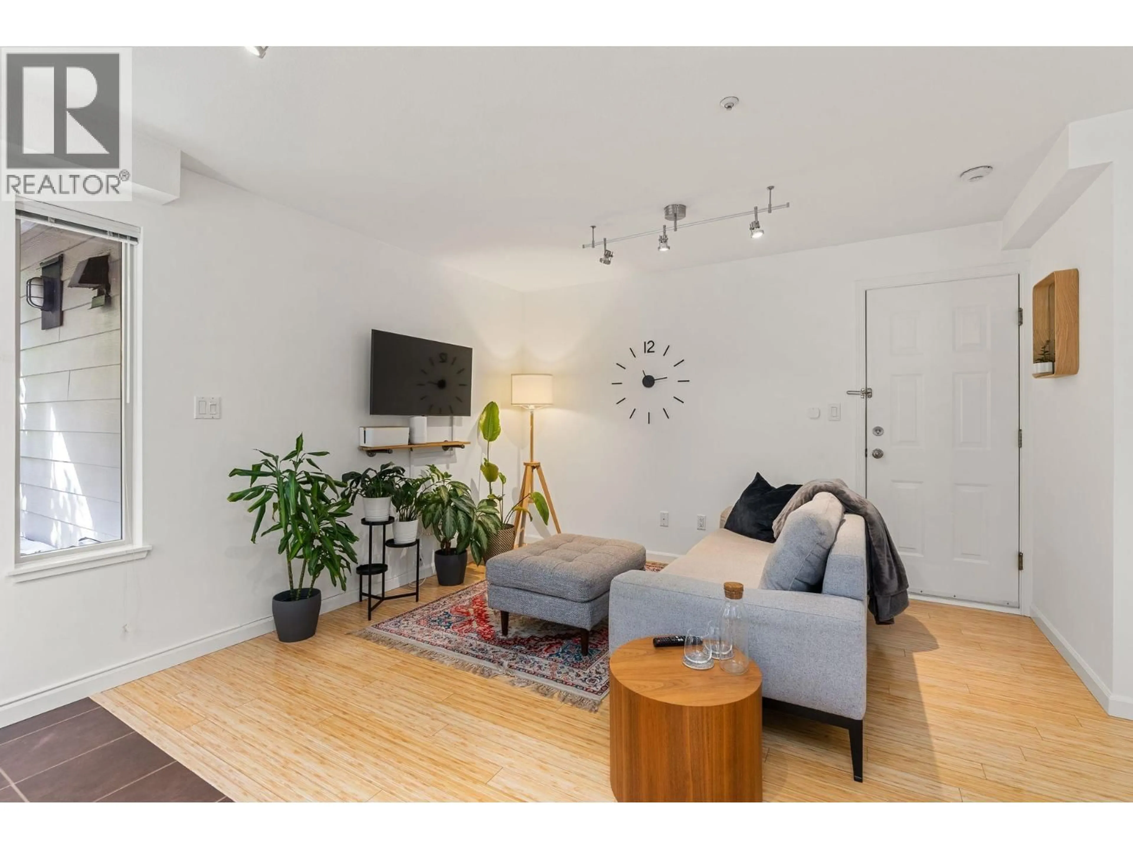 Living room with furniture, wood/laminate floor for 203 - 755 15TH AVENUE, Vancouver British Columbia V5Z1R6