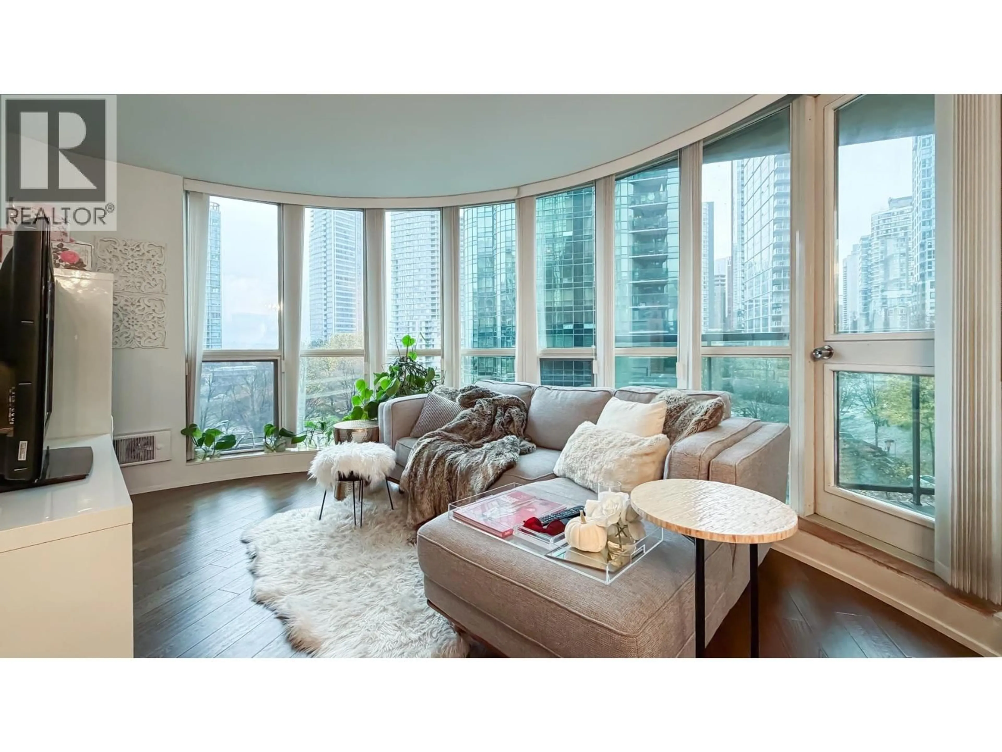Living room with furniture, wood/laminate floor for 506 - 588 BROUGHTON STREET, Vancouver British Columbia V6G3E3