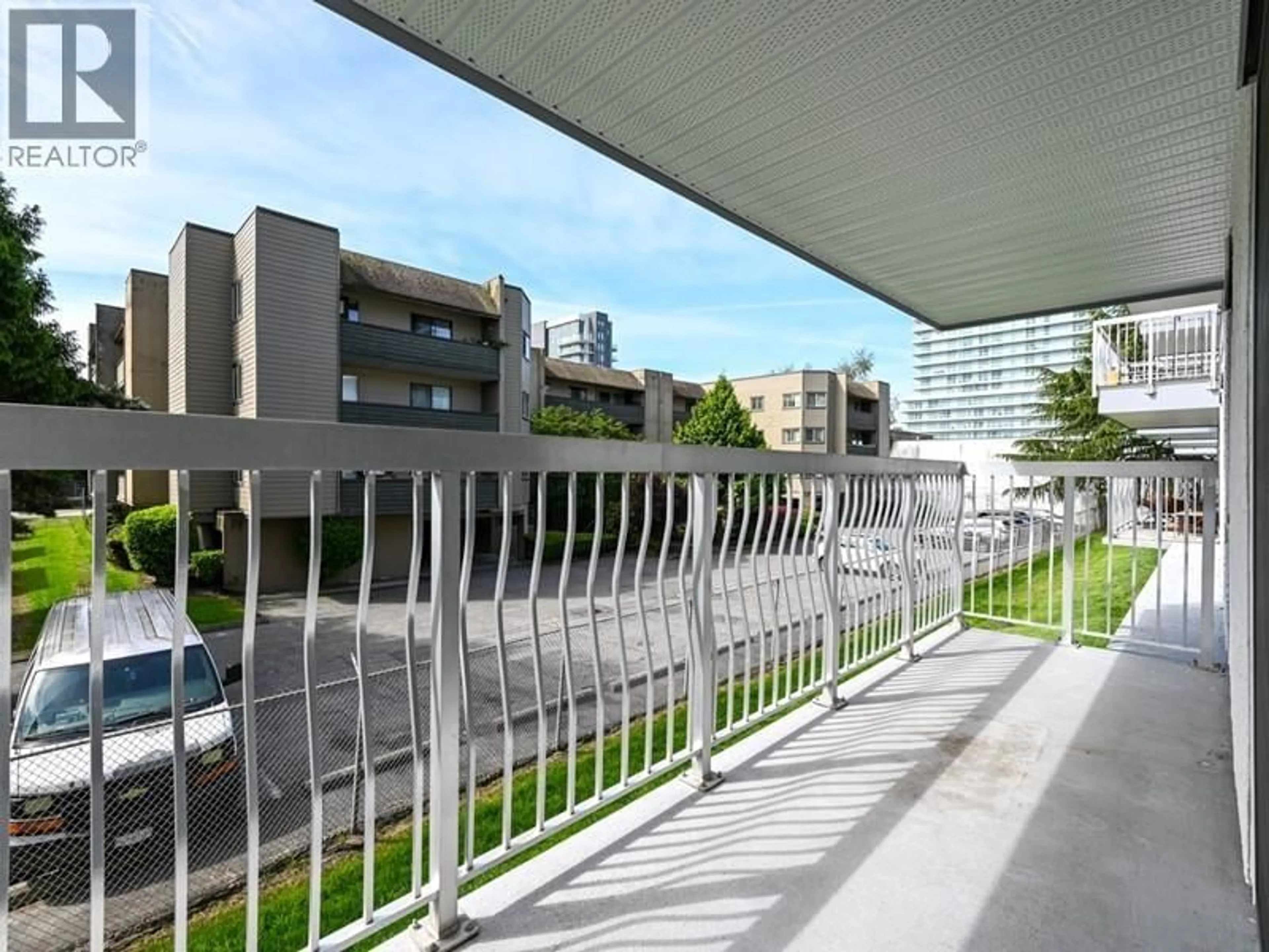Balcony in the apartment, city buildings view from balcony for 110 - 6420 BUSWELL STREET, Richmond British Columbia V6Y2E9