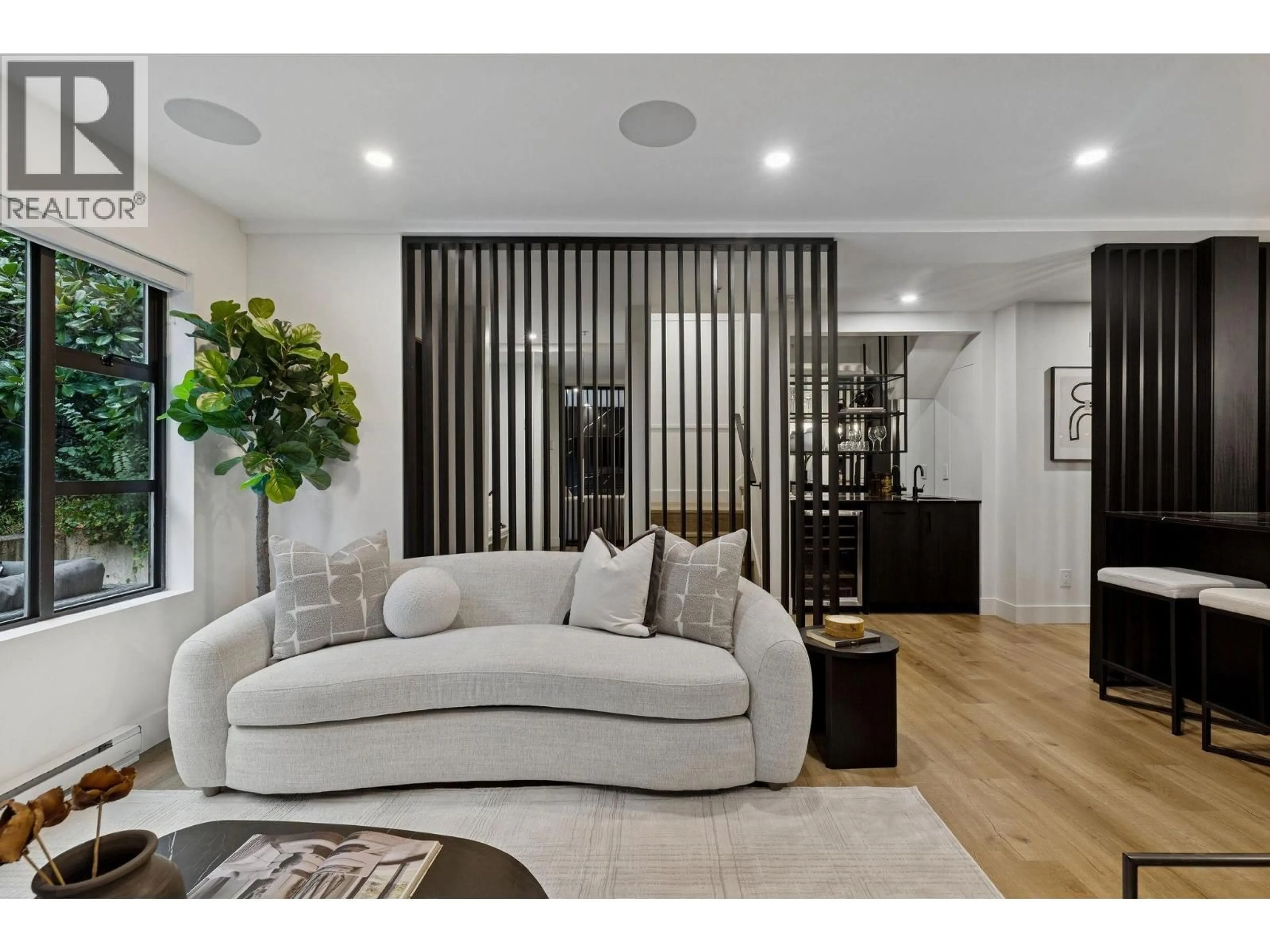 Living room with furniture, wood/laminate floor for 104 - 2119 YEW STREET, Vancouver British Columbia V6K3G6