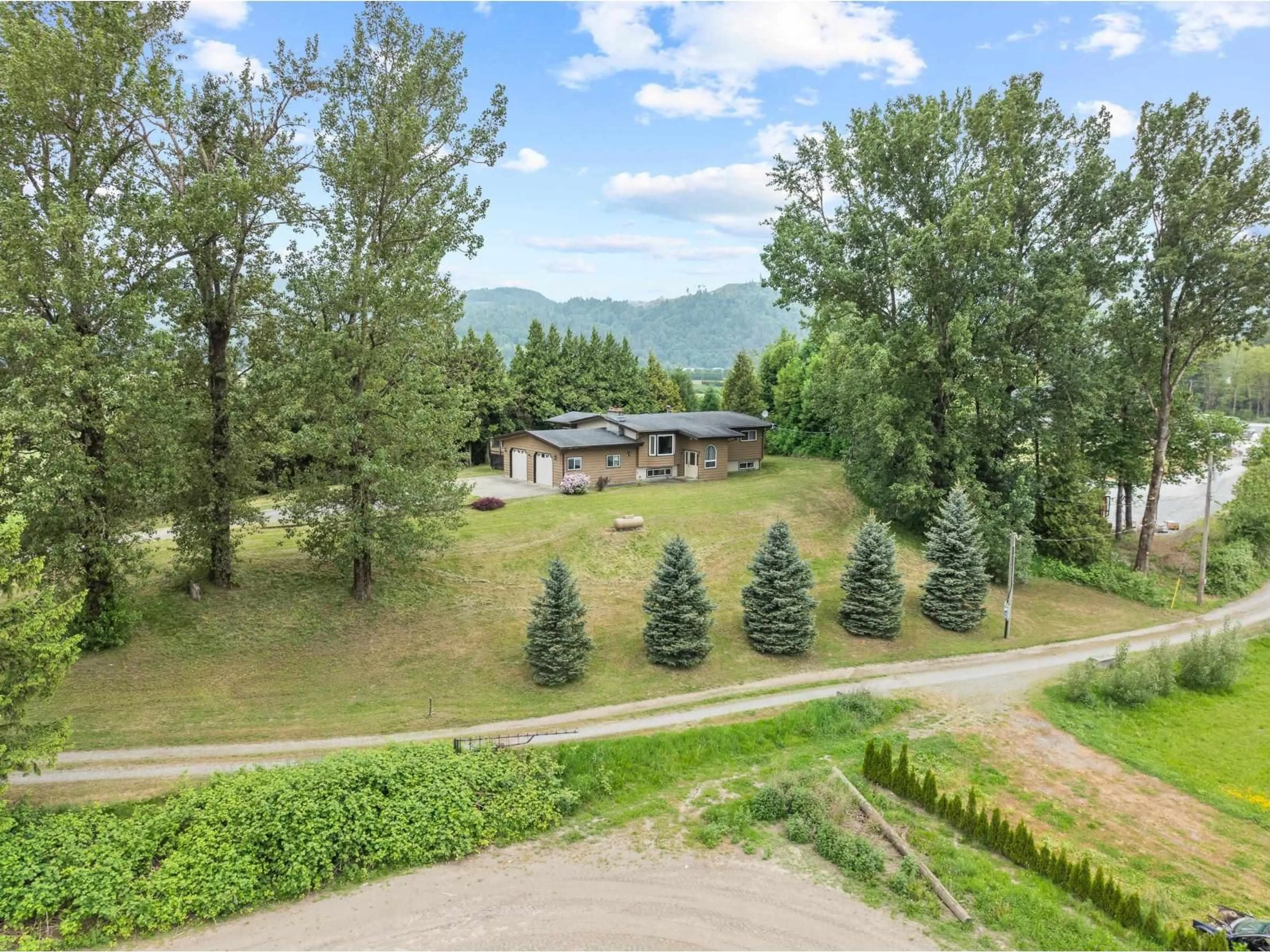 A pic from outside/outdoor area/front of a property/back of a property/a pic from drone, mountain view for 38604 NO 5 ROAD, Abbotsford British Columbia V3G2G3