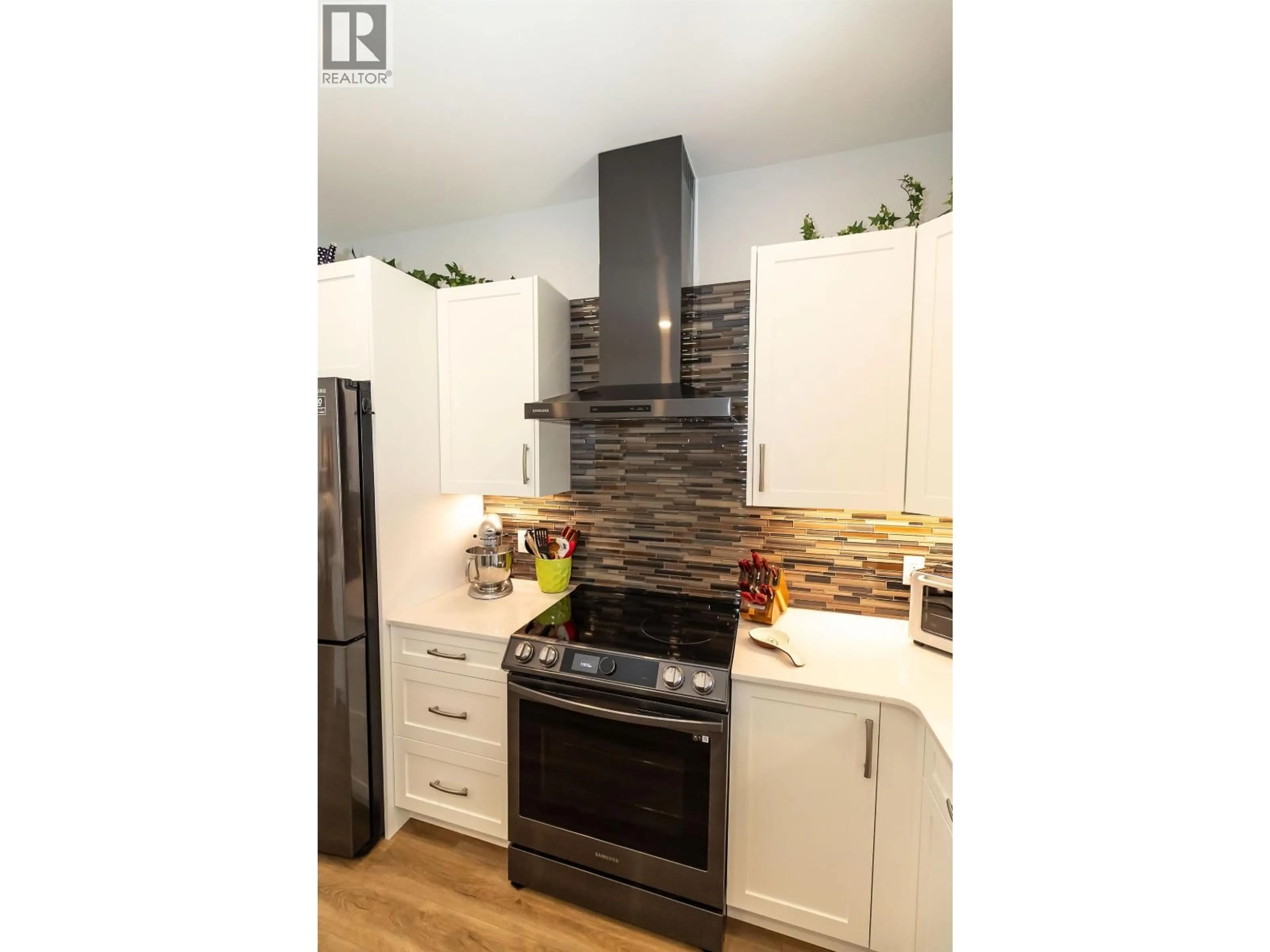 Open concept kitchen, wood/laminate floor for 10 - 4921 HALLIWELL AVENUE, Terrace British Columbia V8G2J7