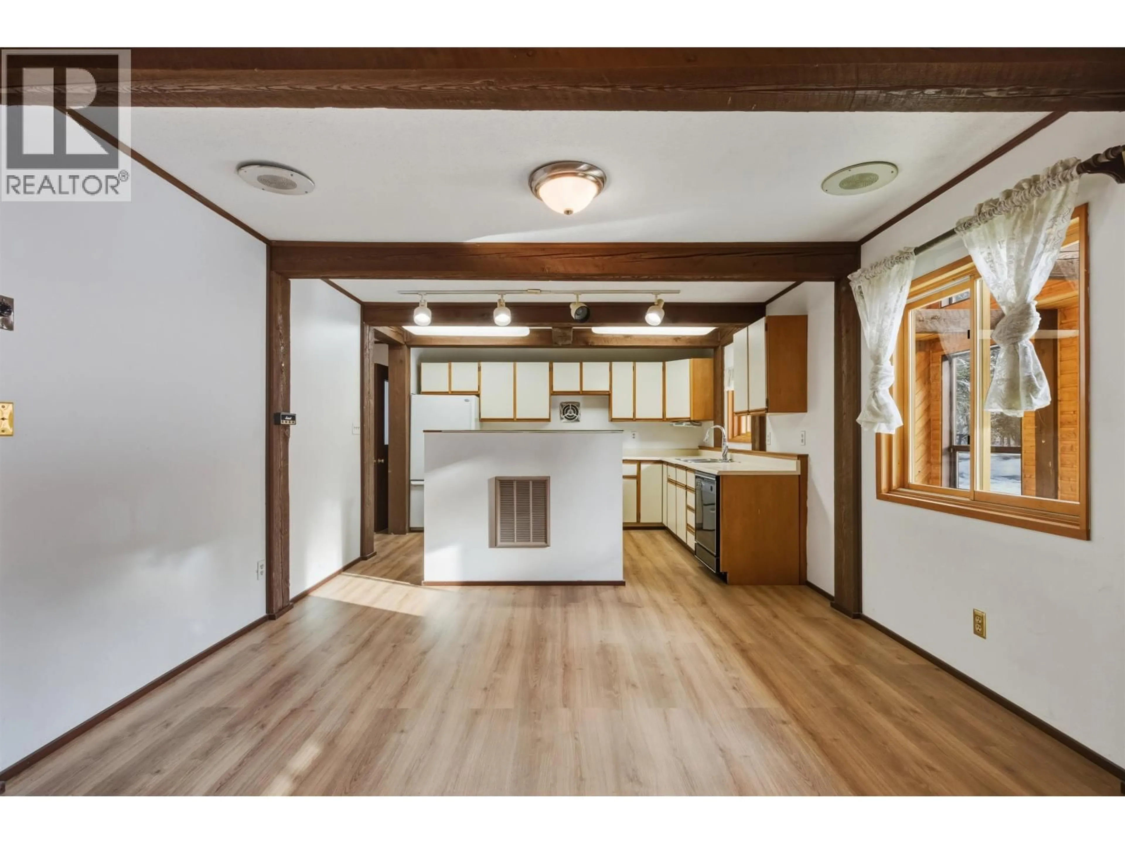 Open concept kitchen, wood/laminate floor for 3339 CRANE ROAD, Williams Lake British Columbia V2G4X4